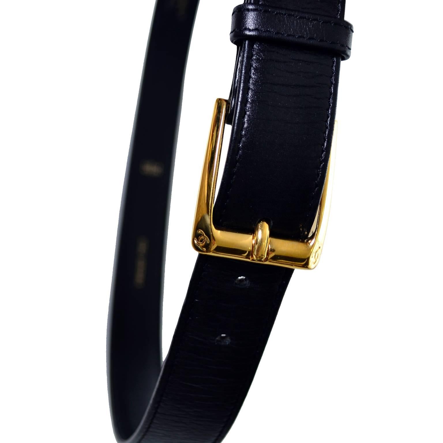 This vintage black leather Chanel belt is timeless. The gold buckle is marked with the Chanel interlocking C logo on both edges and the belt itself is marked CHANEL 98 with the logo and the letter A made in France Veau Veritable and the size 75/30.