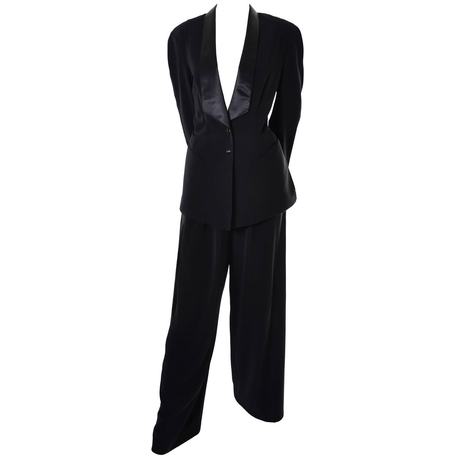 This is an incredible vintage two piece tuxedo pantsuit from Thierry Mugler! This outfit has a beautiful tuxedo style jacket with satin trim and high waisted, wide leg pants with side satin trim.  The jacket snaps in the front and has front pockets