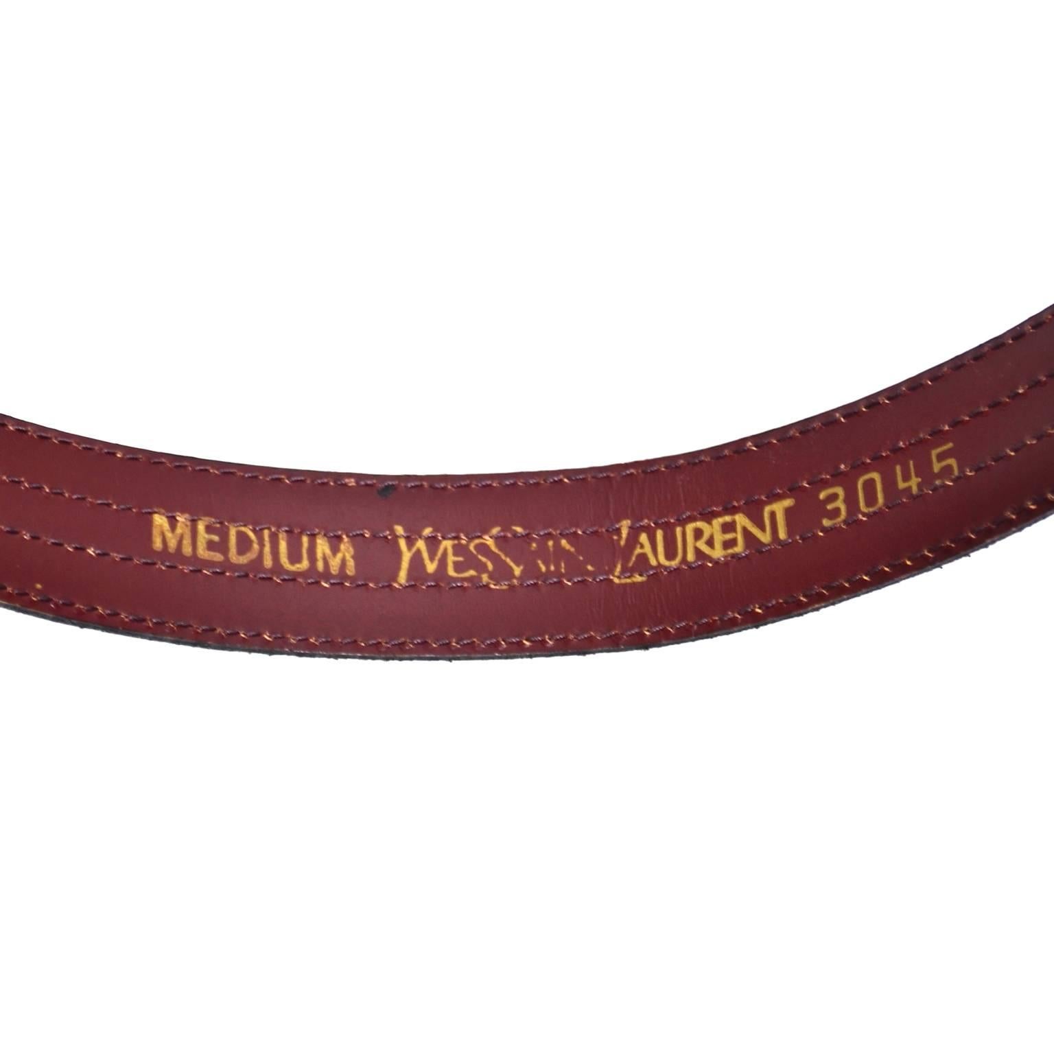 This YSL beautiful copper metallic vintage leather belt is embossed with an alligator skin pattern and is labeled Yves Saint Laurent 3045 MEDIUM.  The belt is in excellent condition.  The back of the belt is brown leather and there is nice top