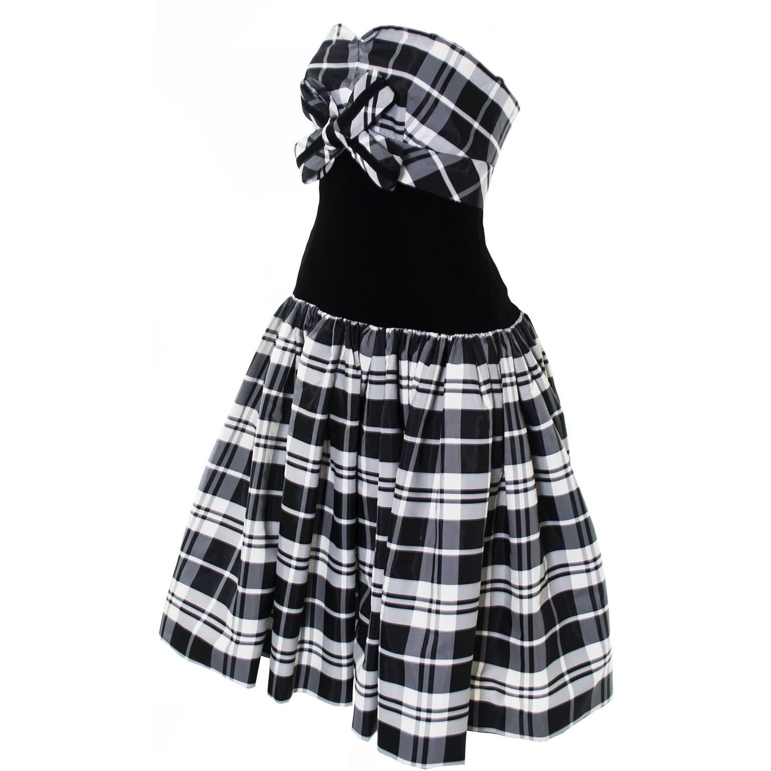 This is a terrific black and white tartan plaid taffeta party dress from Victor Costa.  I have always loved Victor Costa dresses and this one, from the 1980’s is really wonderful and appears unworn. The dress is strapless and lined with tulle for