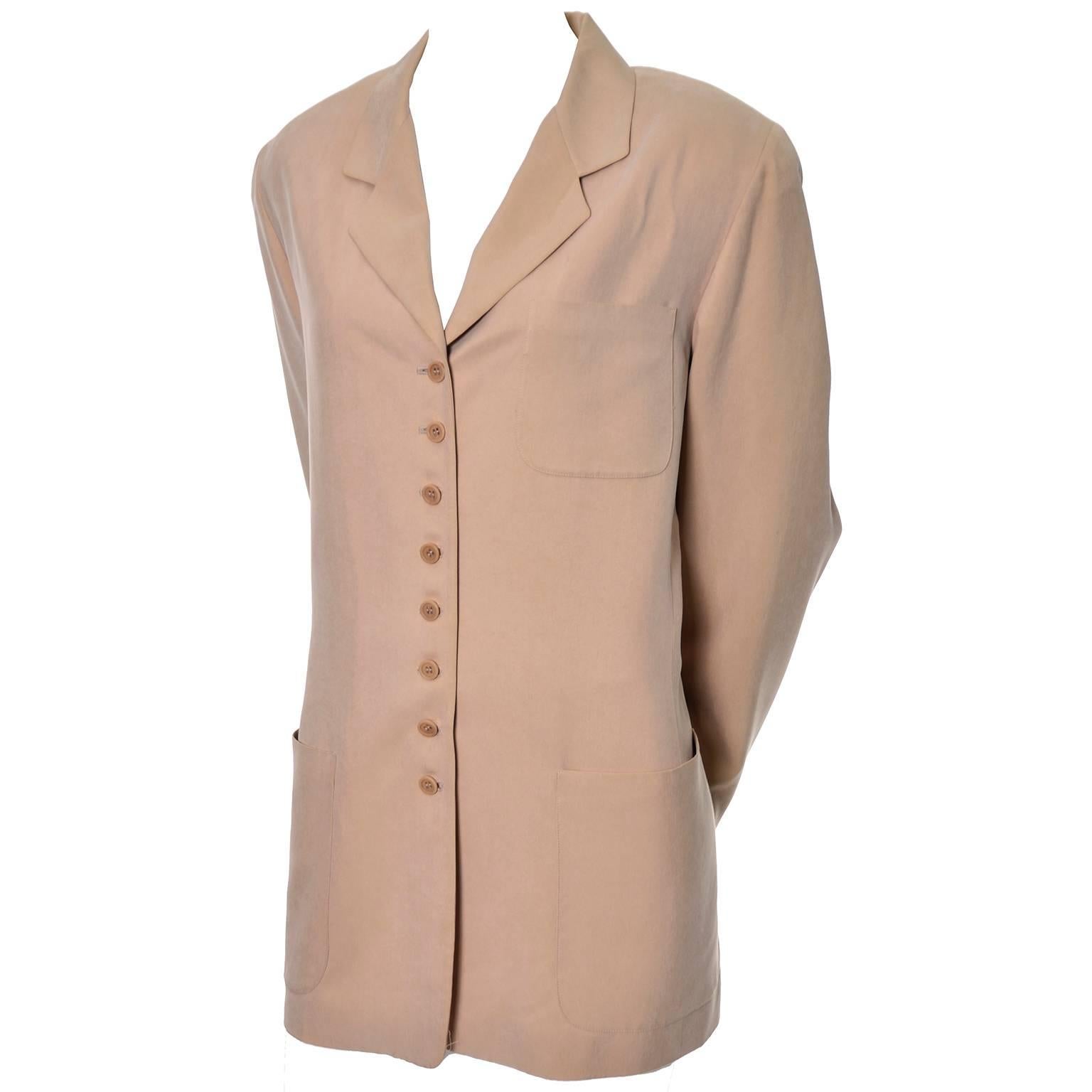 This beautiful sueded silk blazer was designed by Emanuel Ungaro and was made in Hong Kong in the  early 1990's.  This versatile jacket is fully lined and has front pockets, light shoulder pads, and buttons up the front with 8 buttons.  This is