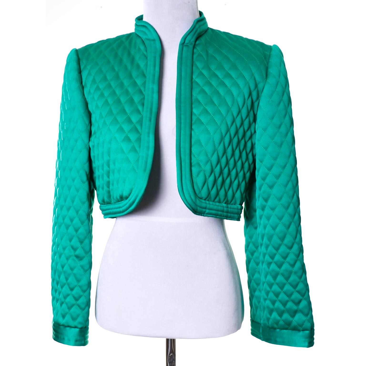 This pretty green vintage cropped jacket from Victor Costa is the perfect thing to wear over that sleeveless cocktail dress or with a pair of wide legged pants! The bolero is quilted satin and is open in the front. Designed by Victor Costa for
