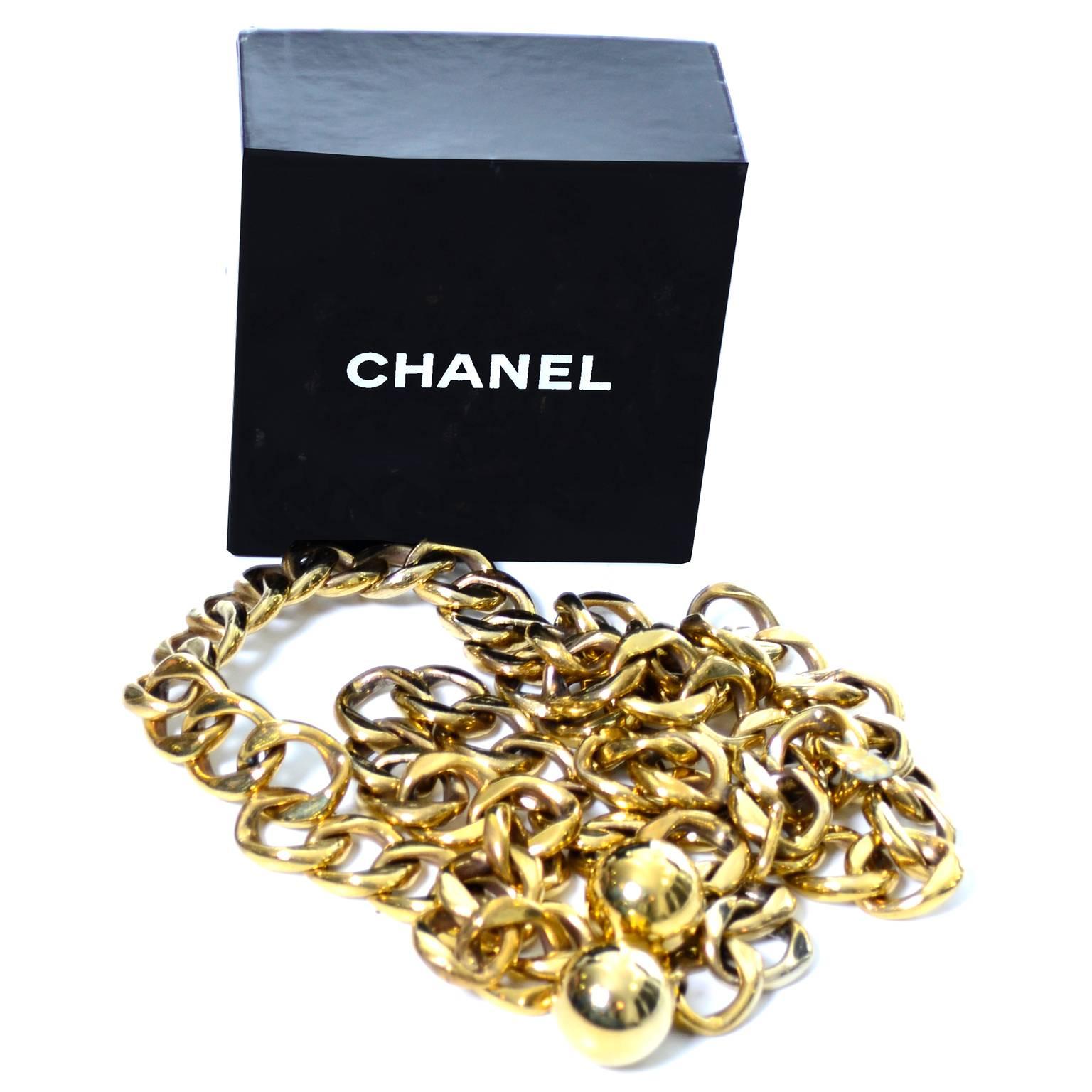This is one of my personal favorite Chanel belts. It has a double row of gold links in the front and a single row in the back and closes with a gold hook.  There are heavy gold balls that hang on the end.  The belt has an adjustable fit and could