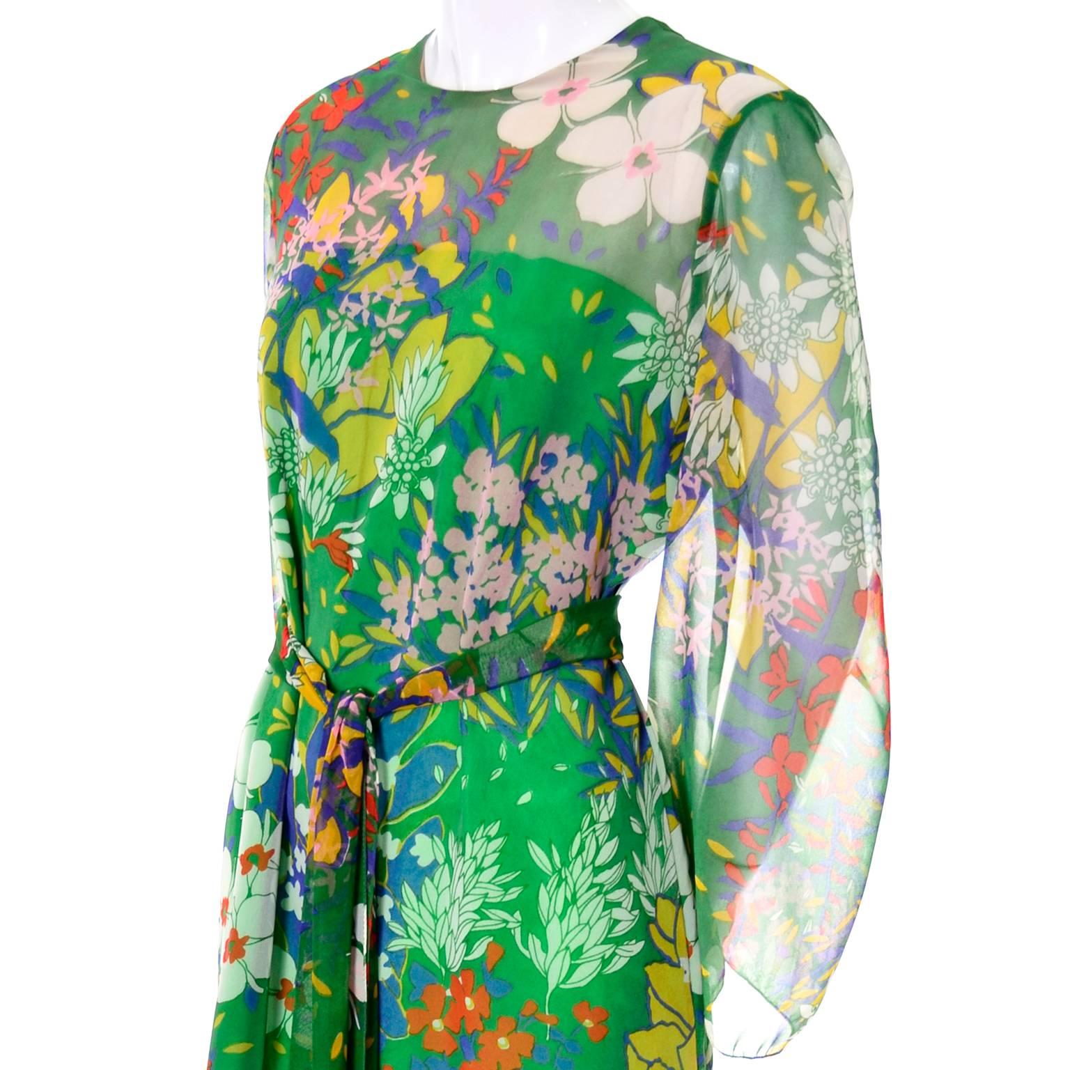 This vintage green floral dress is from  Nat Kaplan Couture and was purchased at I Magnin in the 1960's.  The dress has green satin from the top of the bust line to the hem and is covered with a beautiful floral organza.  This dress is in excellent
