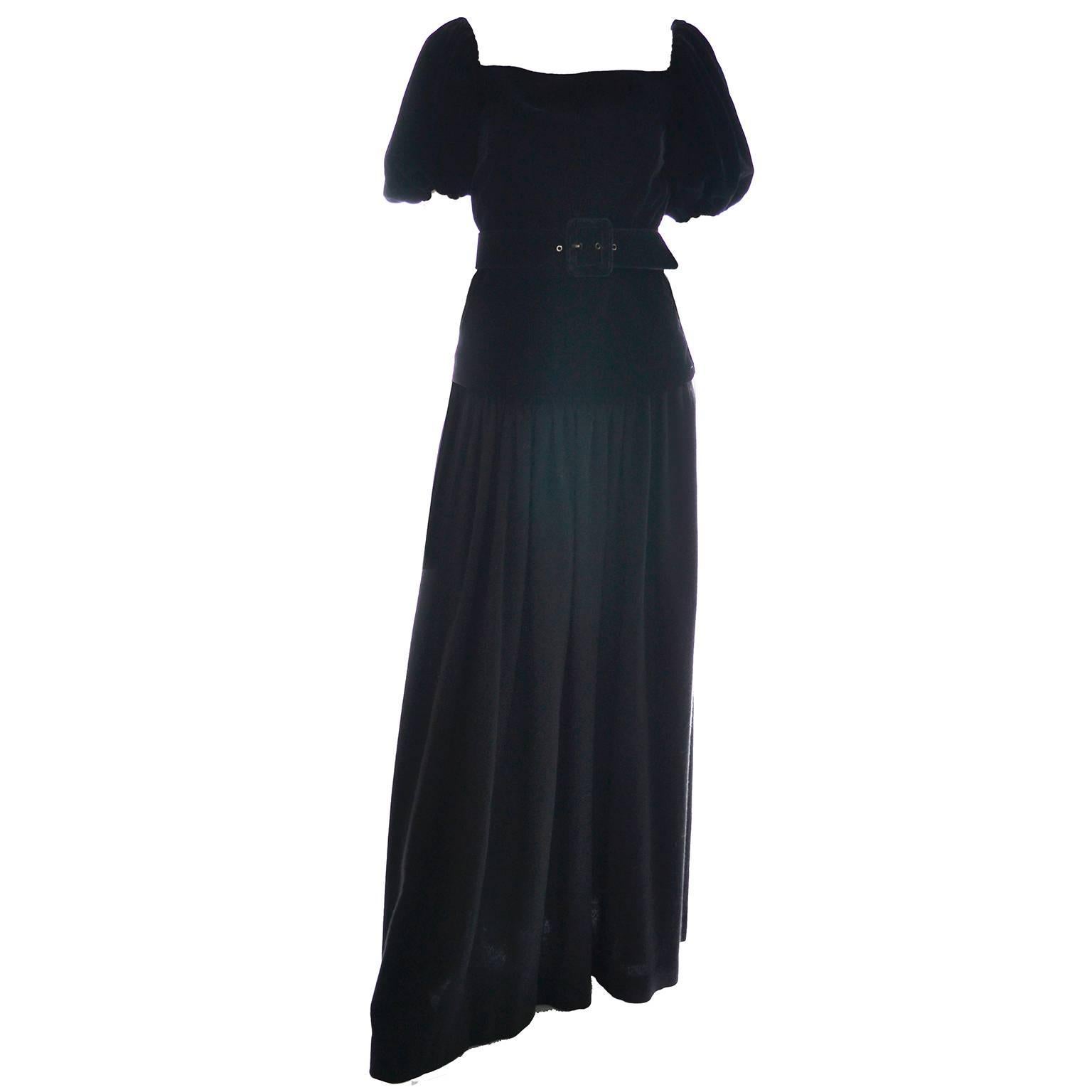 This absolutely gorgeous evening ensemble was designed by Yves Saint Laurent in the late 1970's. This two piece vintage dress includes a luxurious black velvet top with puff short sleeves that could be worn on or off shoulders and either tucked in