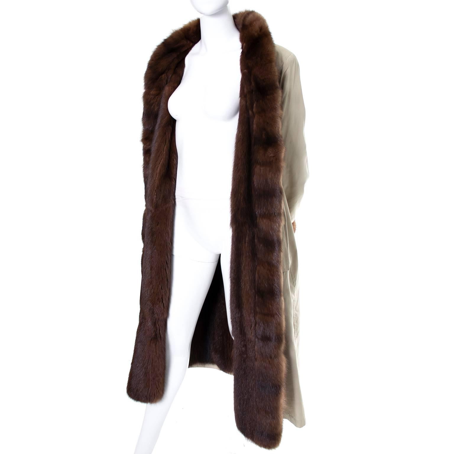 This timeless vintage Yves Saint Laurent coat was made in France and is lined with beautiful fur and comes with an optional belt. The bust fits up to size 44, and there is a hook so you can close it without having to wear the belt. The length of