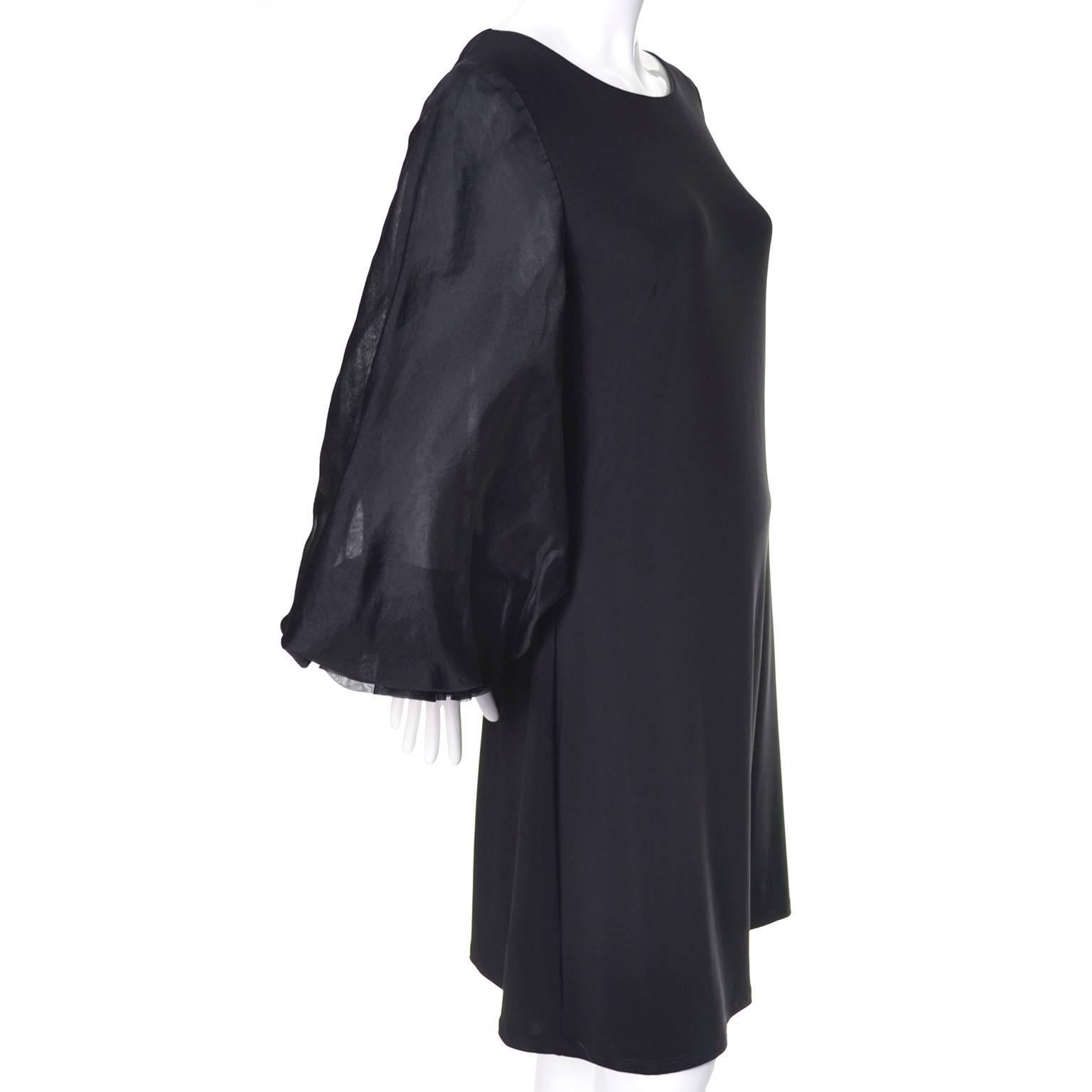 This vintage ABS Allen Schwartz Collection black jersey cocktail dress has fabulous organza statement sleeves.  This dress is in excellent condition and the sleeves are remarkable with pleats under the cuffs that create fullness. This dress has such