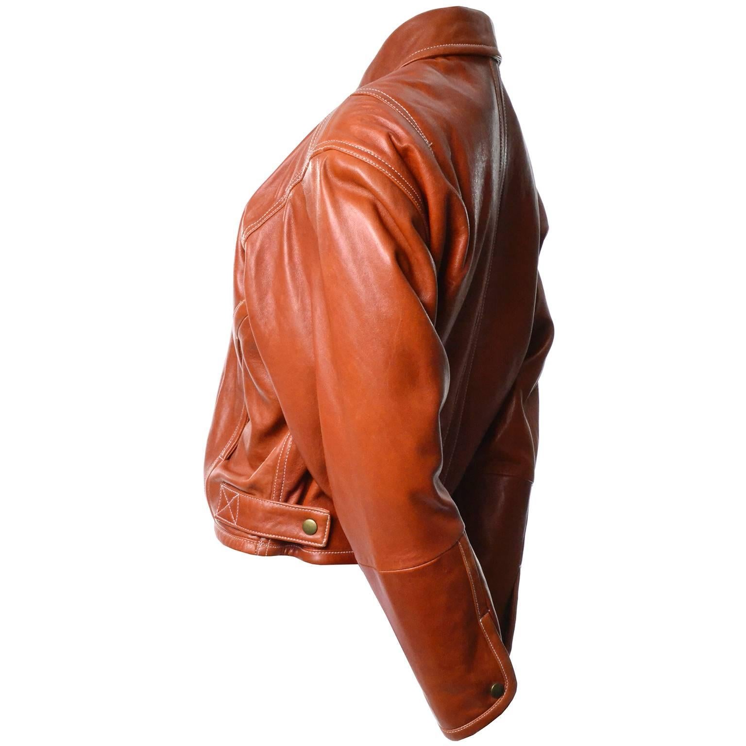 This caramel leather vintage coat came from an unbelievable estate of vintage designer clothing.  One of our favorites of all time!  This 1980's bomber jacket was designed by Kara George and it is so well made. The leather is exceptionally thick,