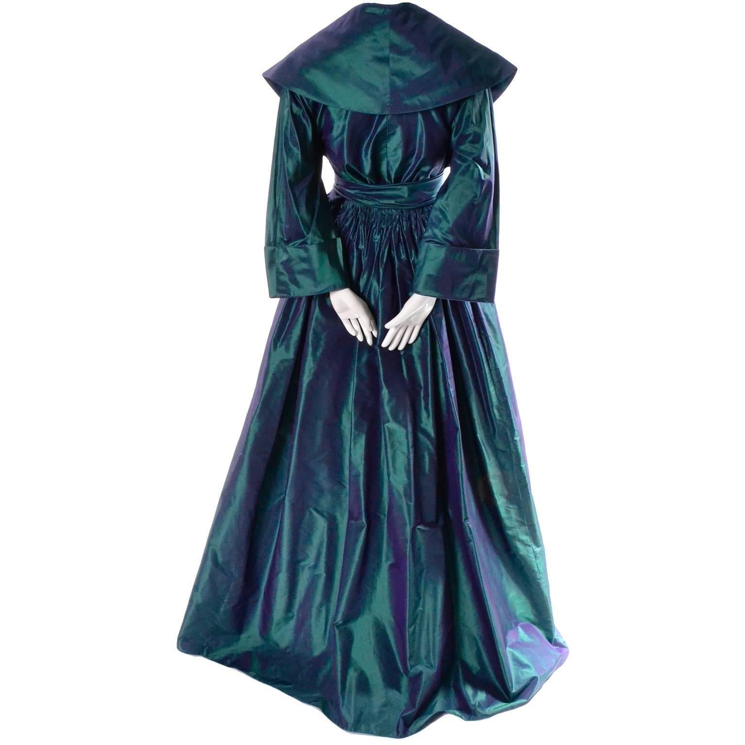 This extraordinary vintage evening gown was designed by Carolyne Roehm and purchased at Bergdorf Goodman in the 1980's.  This stunning iridescent peacock blue green dress is made of a gorgeous taffeta and it closes at the waist with a snap and hook