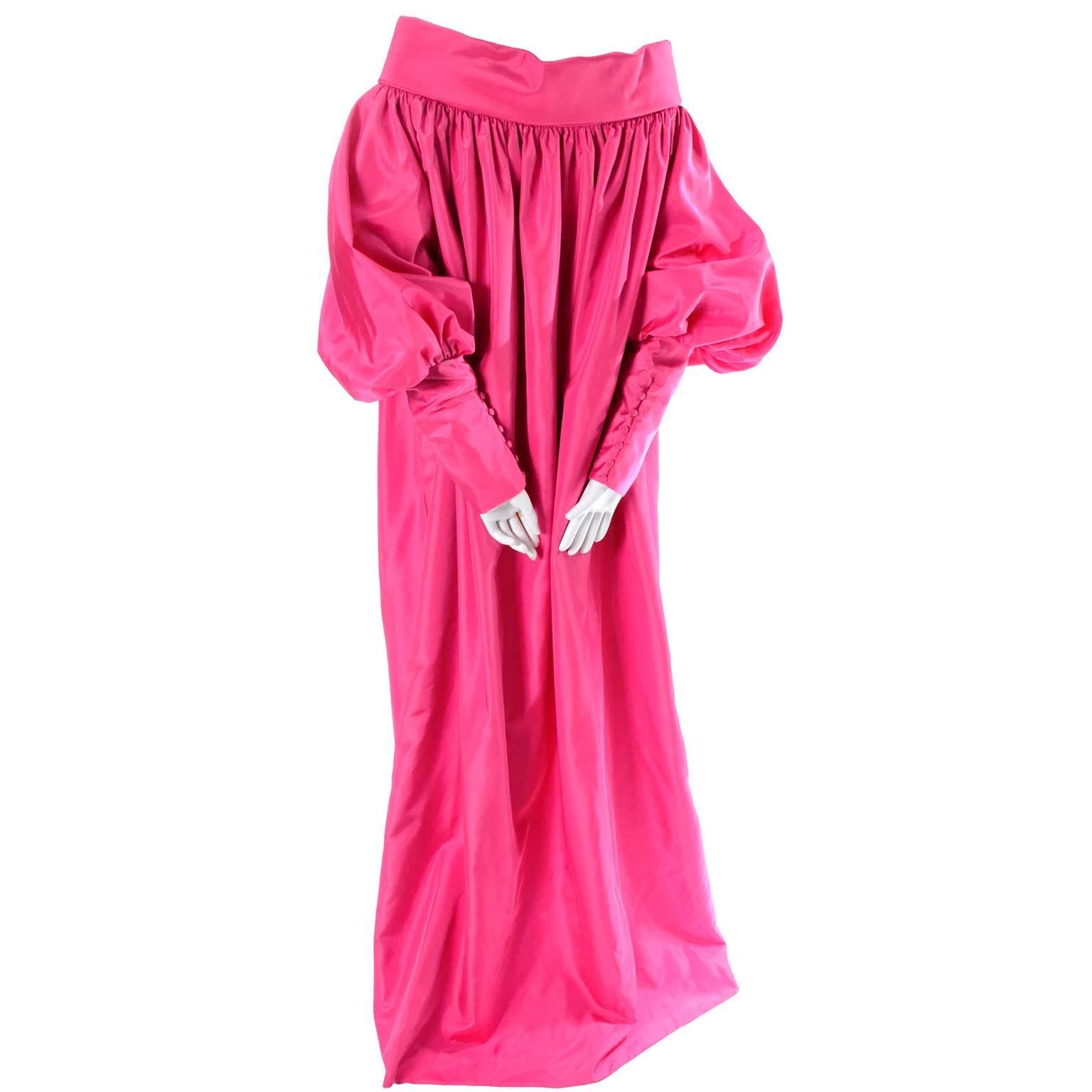 This exquisite pink satin evening coat is stunning and has incredible statement sleeves with 9 and 1/2
