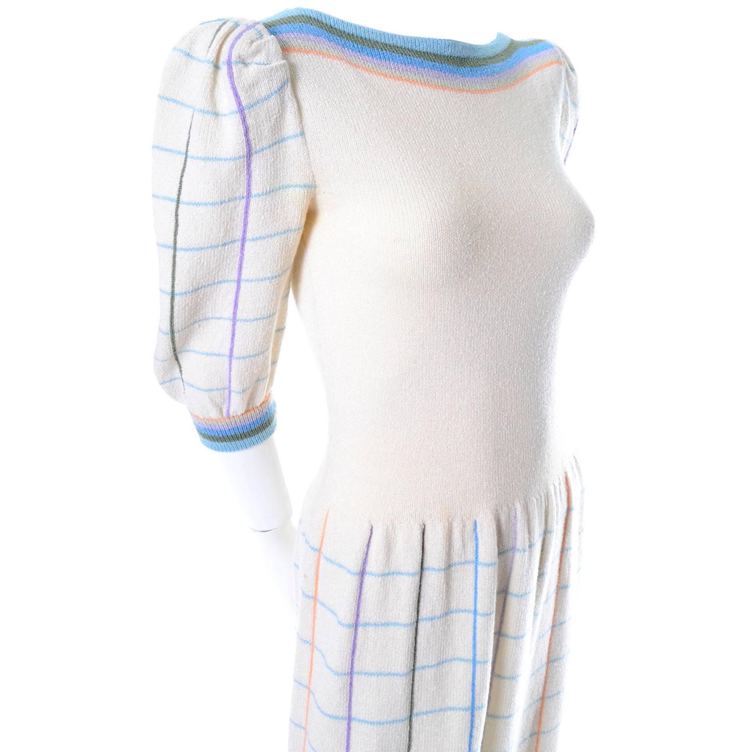 This adorable creamy winter white Adolfo vintage dress was purchased at I Magnin in the 1970's.  The dress is made of a wool/rayon blend knit and has pretty pastel window pane plaid on the skirt and sleeves, and pastel stripes on the collar and