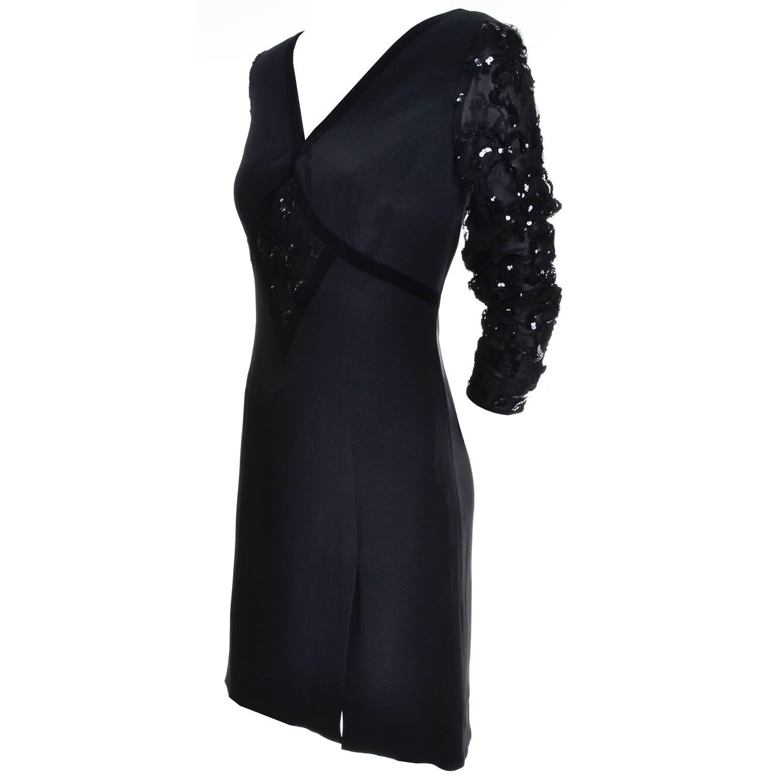 This is a great vintage little black dress from Escada couture.  The dress is silk with velvet trim and sequins.  The sleeves are sheer silk chiffon covered in sequins with covered buttons at the cuffs.  There is a back zipper, a front side slit,