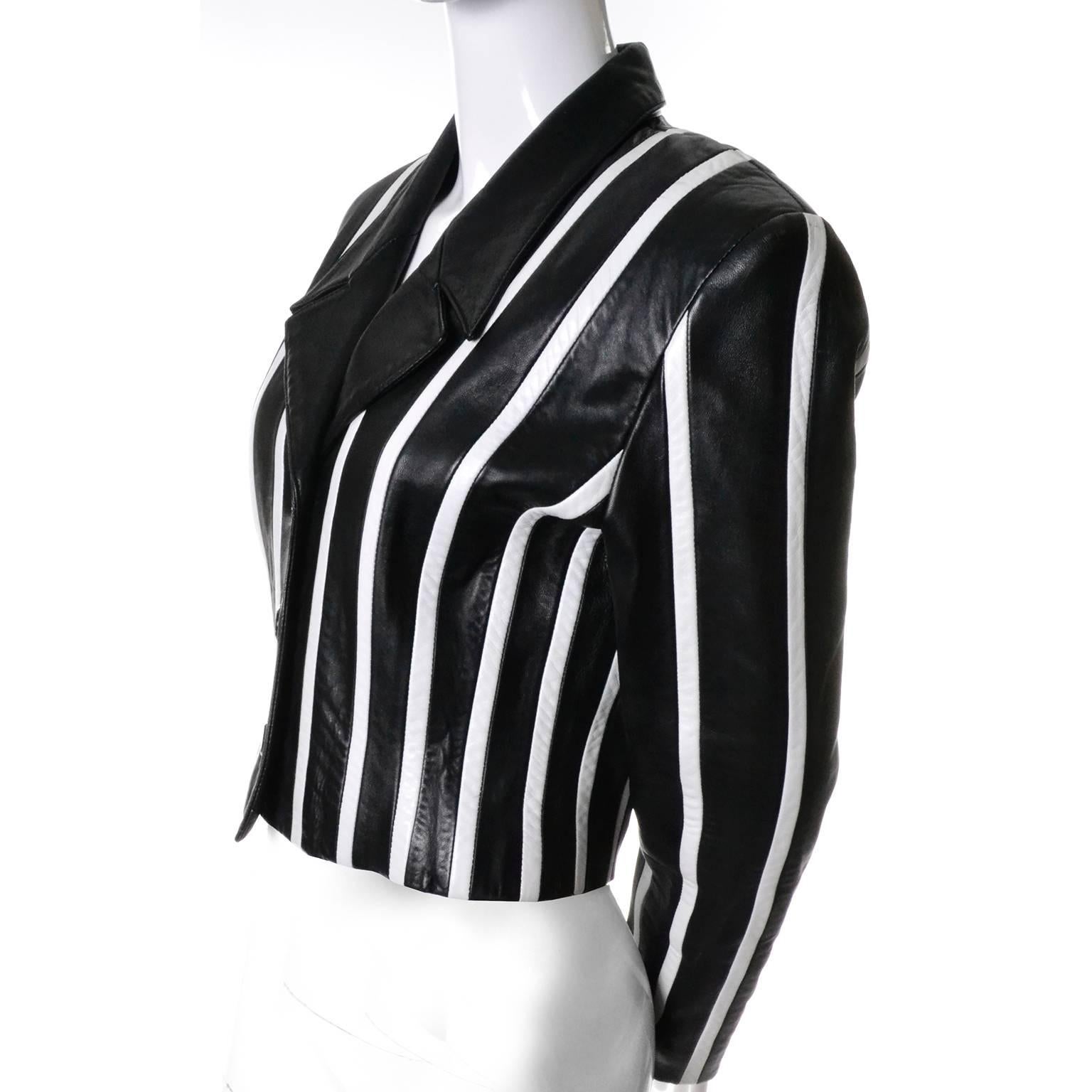 This is one of our favorite leather jackets designed by Michael Hoban for North Beach Leather.  The jacket has black leather lapels, black leather covered front buttons and the body is black with white vertical stripes.  This fully lined cropped