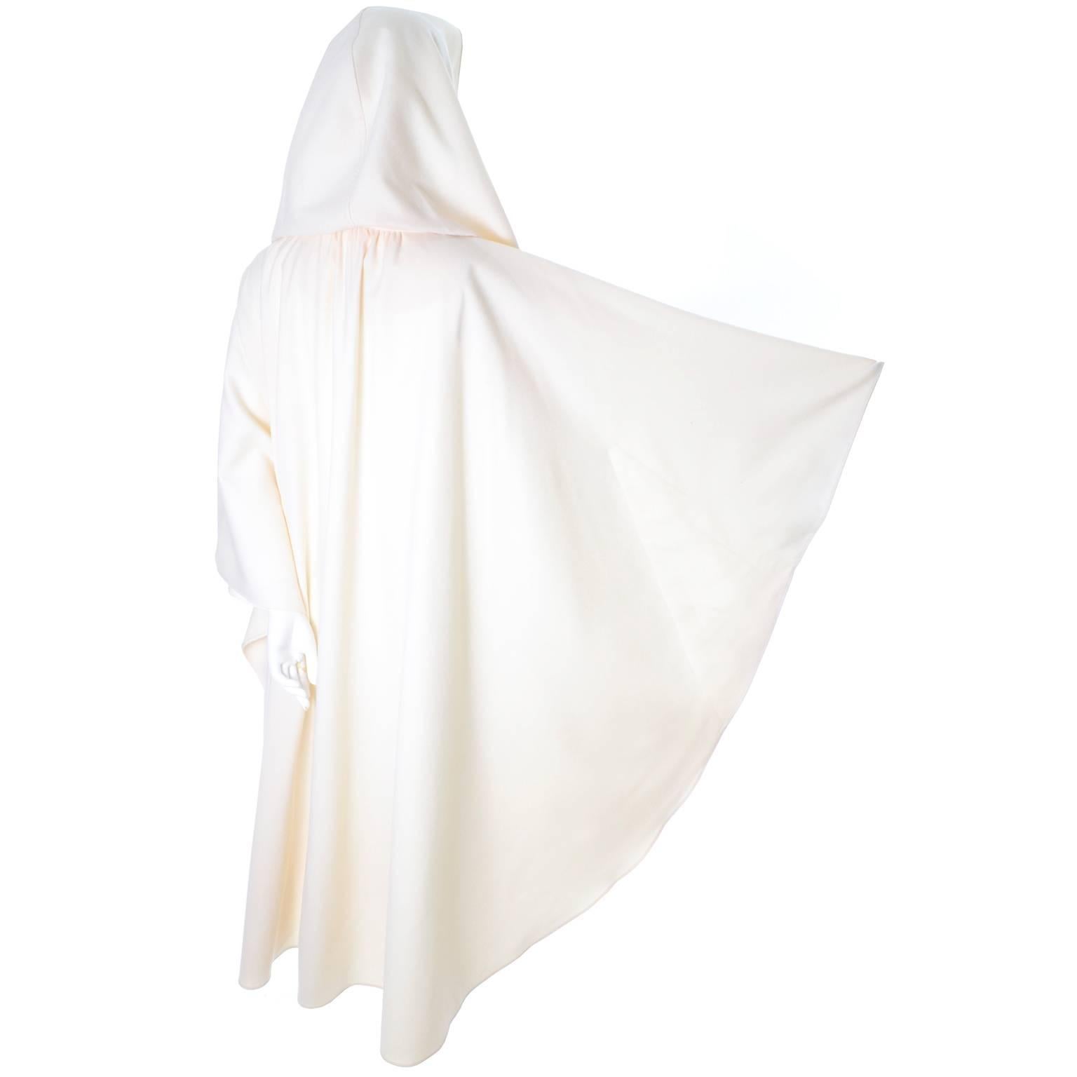This one size cloak or cape is in pure winter white wool and has a single button closure at the neck.  The cape has a 17