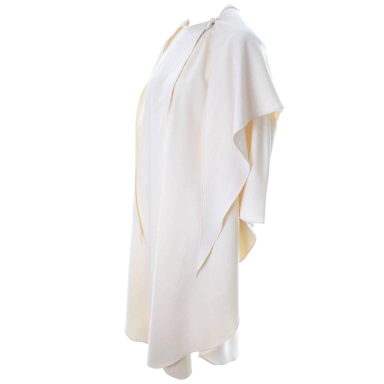 sachin and babi light blue dress Winter bridal cape, elegance and warmth for your wedding main image 0