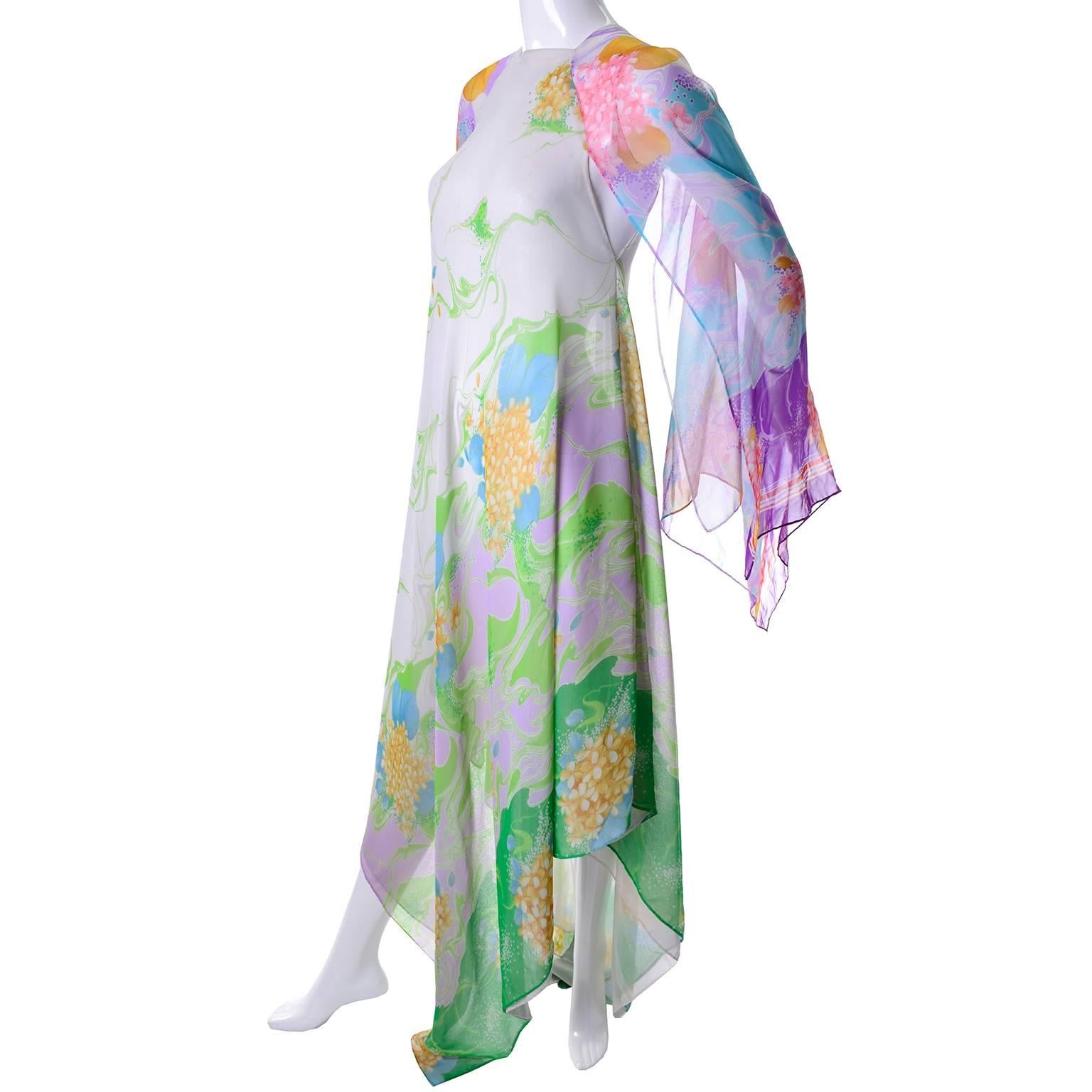 This beautiful 70's vintage caftan is from an estate we acquired that had several amazing caftans from the 1970's and 1980's.  This one is long in the front and back and shorter on the sides. There is a single hook at the neck and the body is lined.