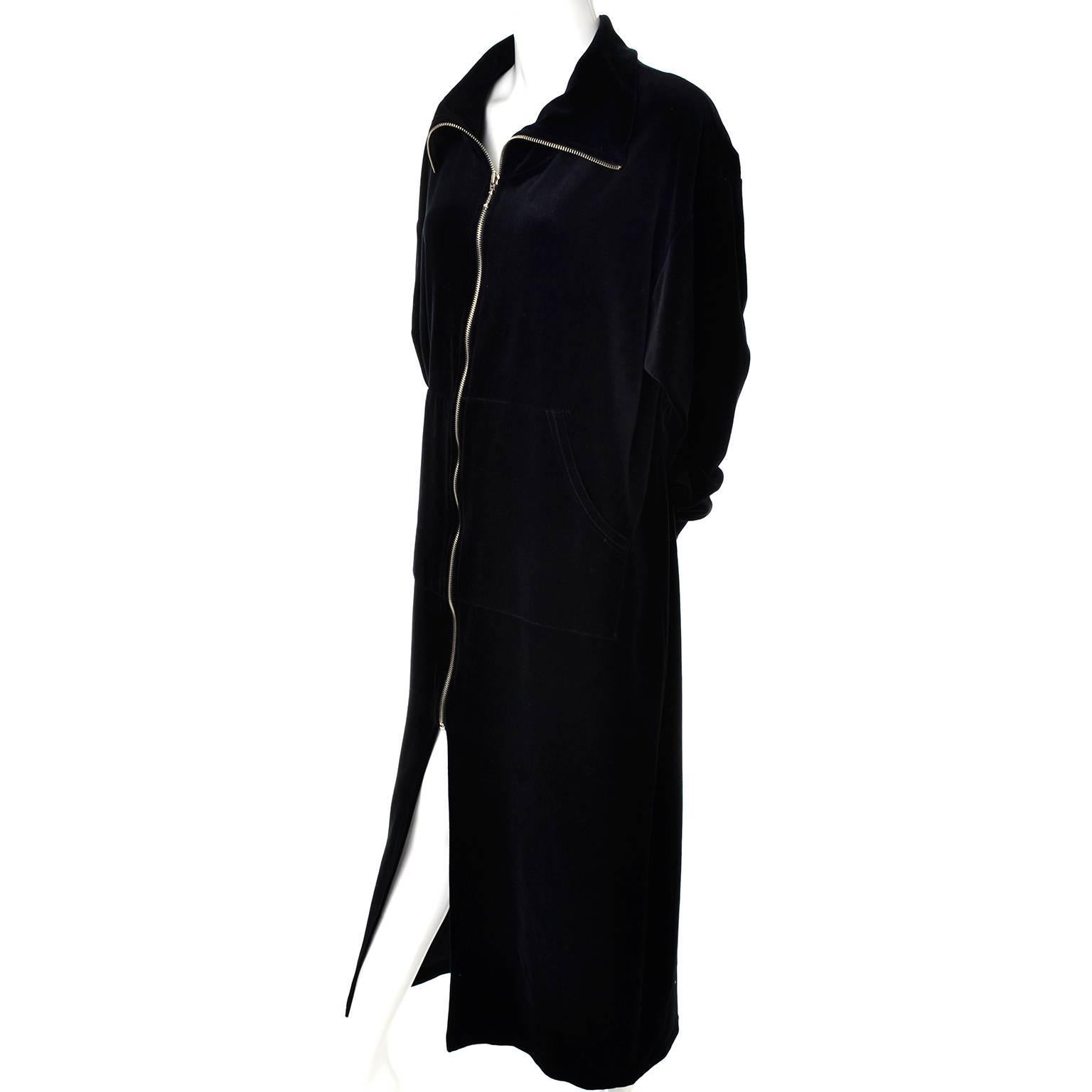 This is a plush Donna Karan Intimates size medium black velveteen zip front robe. This robe is in excellent condition and is 80% cotton and 20% poly.  There is a front slit from the bottom of zipper and the zipper can zip all the way up to form a