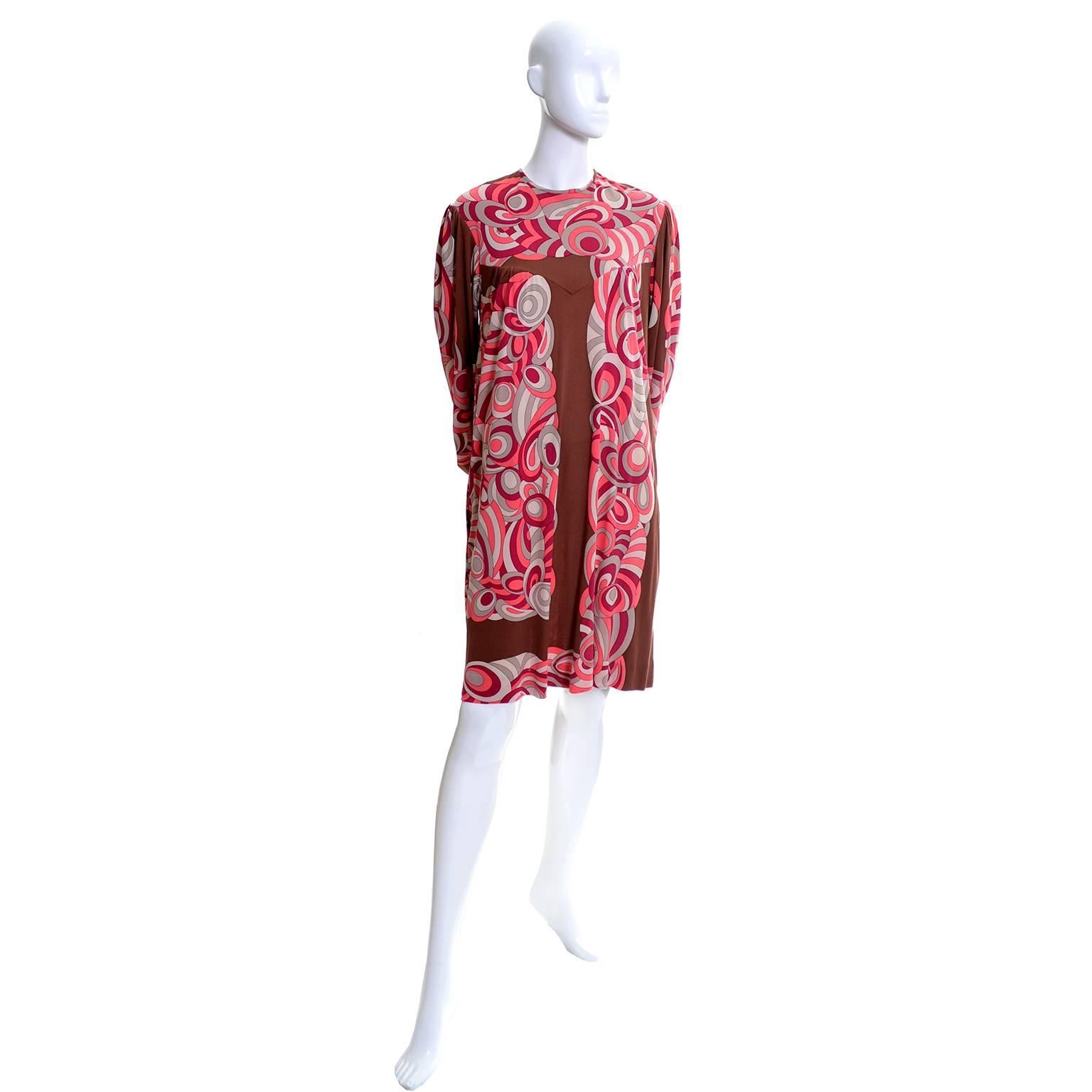 This fab vintage silk jersey Emilio Pucci 1970's dress came from the estate of a woman who knew Emilio Pucci and often visited him at his home in Italy.  The dress is in a brown and raspberry pinky red, coral and gray iconic Pucci design.  This fun