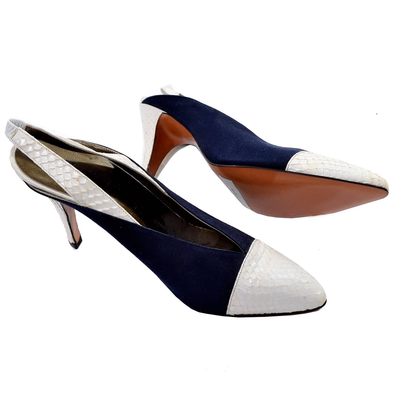 Beautiful Yves Saint Laurent vintage heels with white snakeskin toe, heel, and strap. Slingback style with a pointed toe and navy sides. The slingback strap has a small piece of white elastic in the back for comfort and ease slipping into these