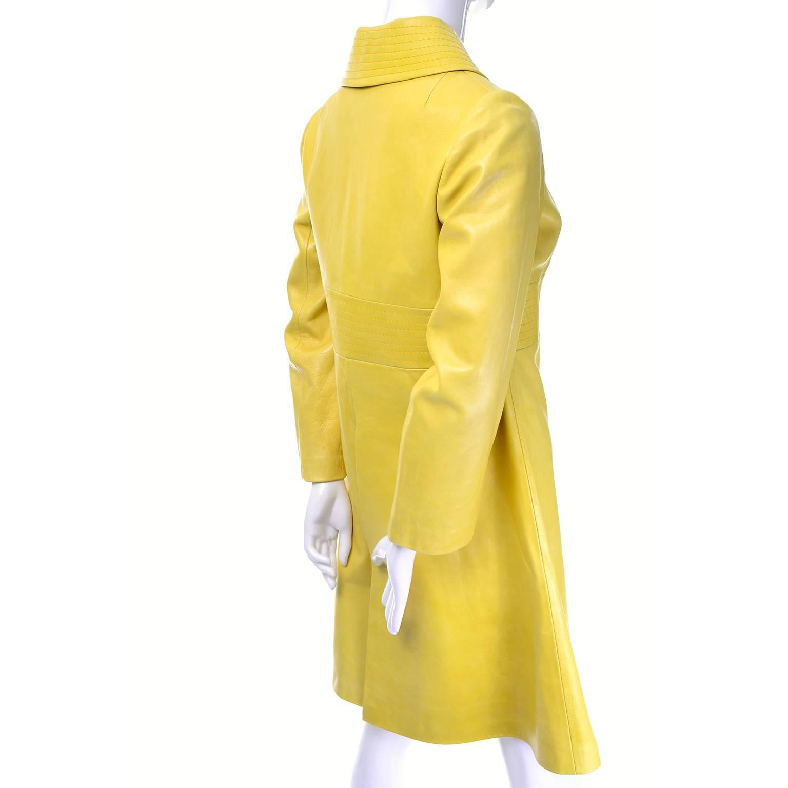 This is an exceptional vintage 1960's yellow leather coat! The coat is fully lined and has great square leather buttons. The approximate size is a 2/4 and other than a pin dot spot on the lining, it is in excellent condition. There is a center pleat