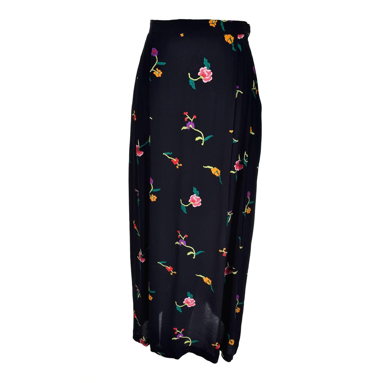 This pretty vintage floral silk skirt was designed by Norma Kamali and is labeled a size 10. The skirt has a side zipper and double pleats at the bottom that allow it to form a fish tail effect.  The skirt has a 30