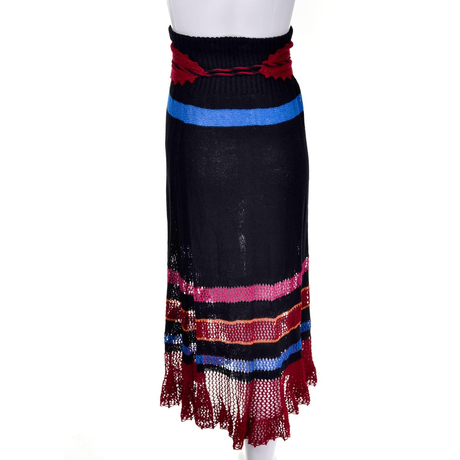 This outstanding vintage skirt is from Giorgio di Sant' Angelo and it comes with its original belt. The skirt is black knit with multi colored stripes and a strong, elastic waist. We've shown it being worn as a skirt and as a strapless dress with a