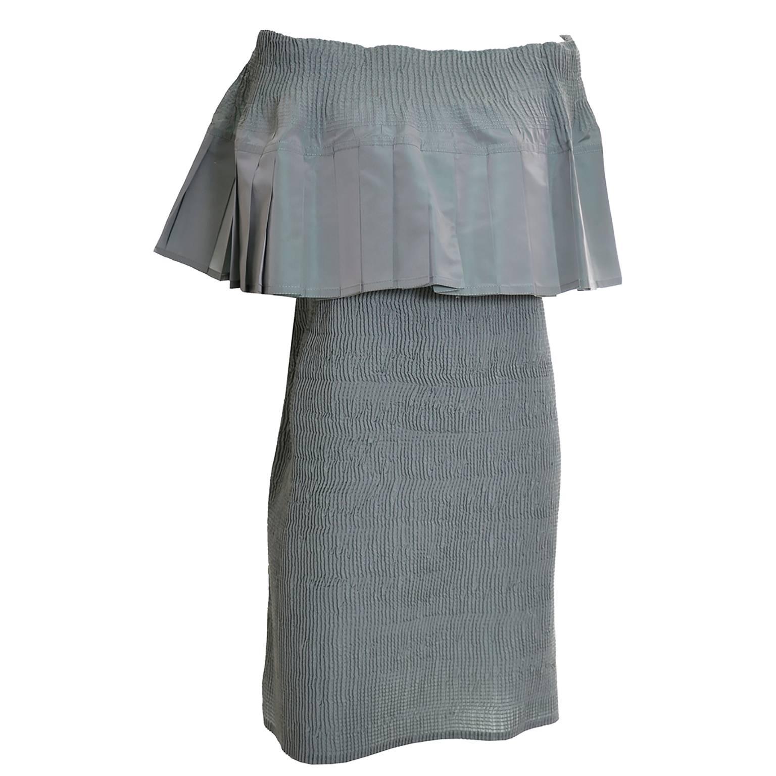 This pistachio green iridescent taffeta satin dress was designed by Angelo Tarlazzi in the 1980's.  This perfect spring/summer dress would be a great addition to your wardrobe.  This piece is exquisitely made with shirring and a wide off shoulder