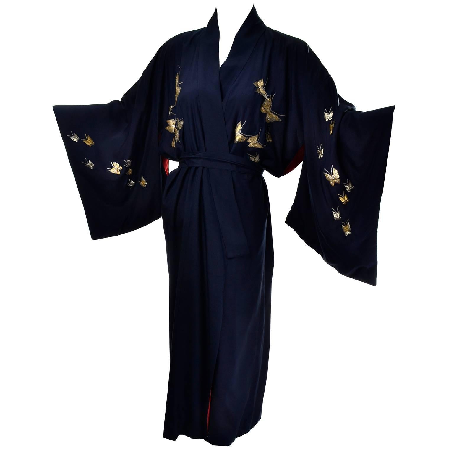 This is an incredible vintage kimono! The midnight blue silk is embroidered with butterflies in gold metallic thread and the piece is lined in deep pink, almost red silk.  We love vintage kimonos and this one is truly exceptional! Made in Japan