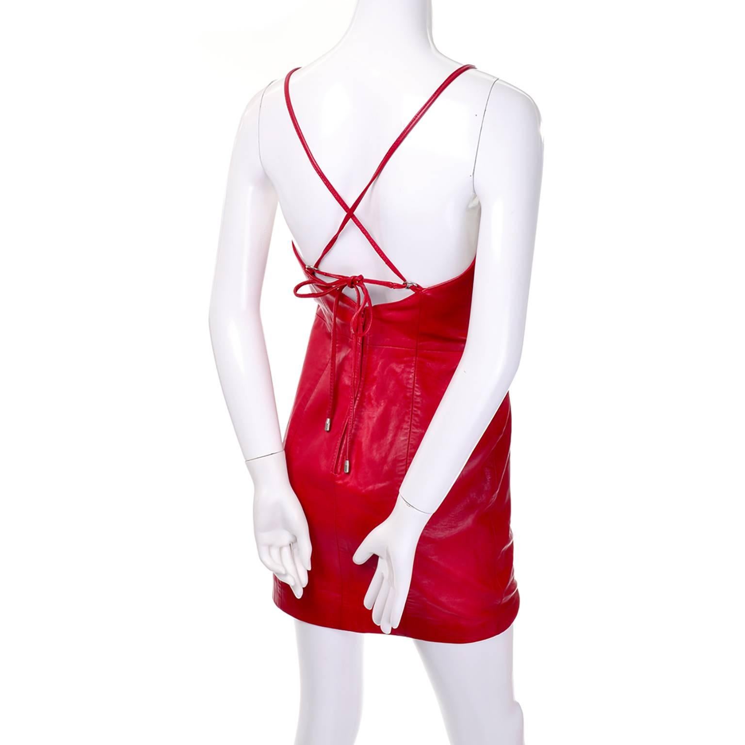 This is a great cherry red bodycon vintage leather dress from Michael Hoban for North Beach Leather.  The dress has criss cross straps on the open back and a back zipper.  
Bust: 36