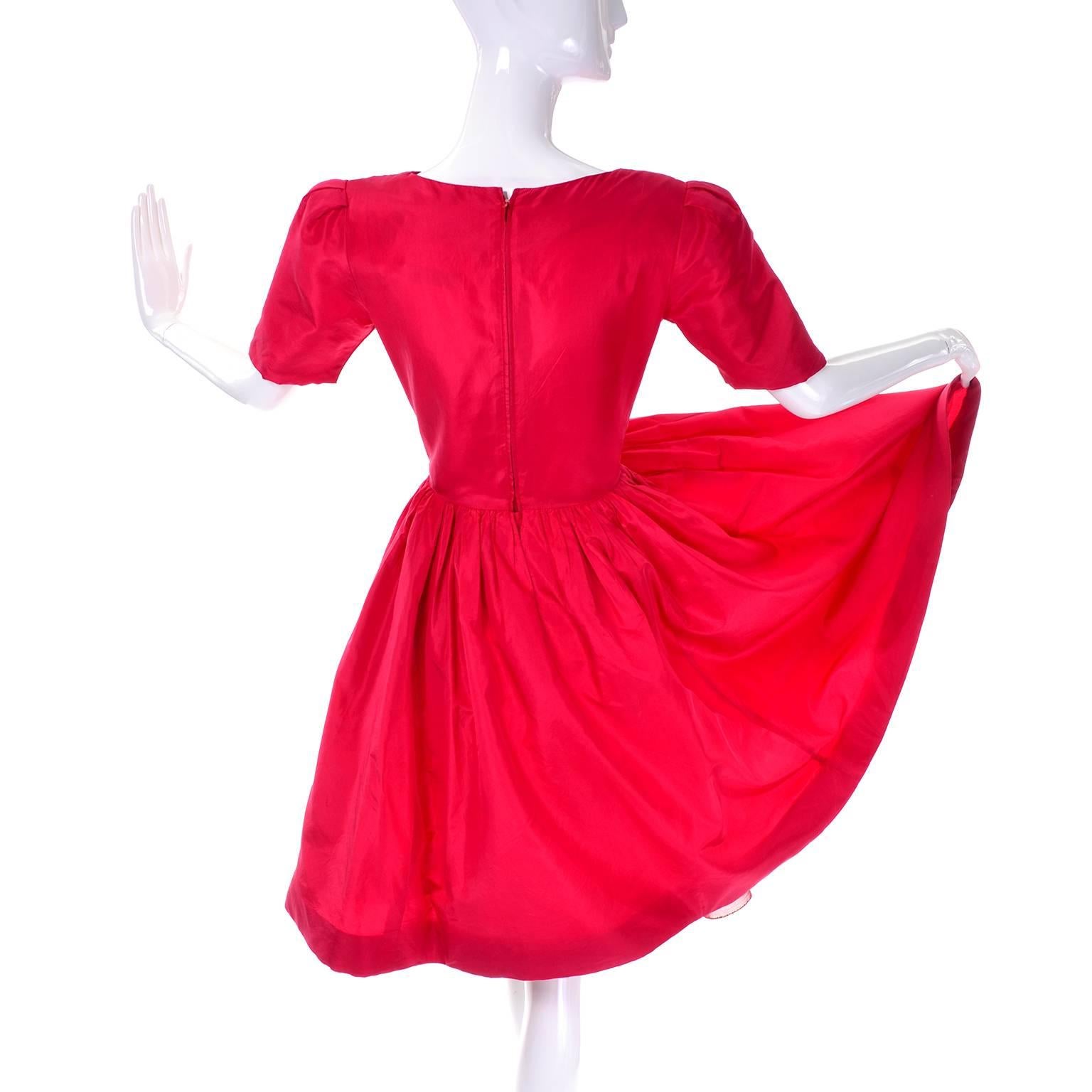 Miss O by Oscar de la Renta vintage red dress purchased at Bonwit Teller Designer Collections.  This 100% Silk dress is labeled a size 4 and has a full skirt. The dress is lined in a fine gauze in the bodice, and has an underskirt to accentuate the