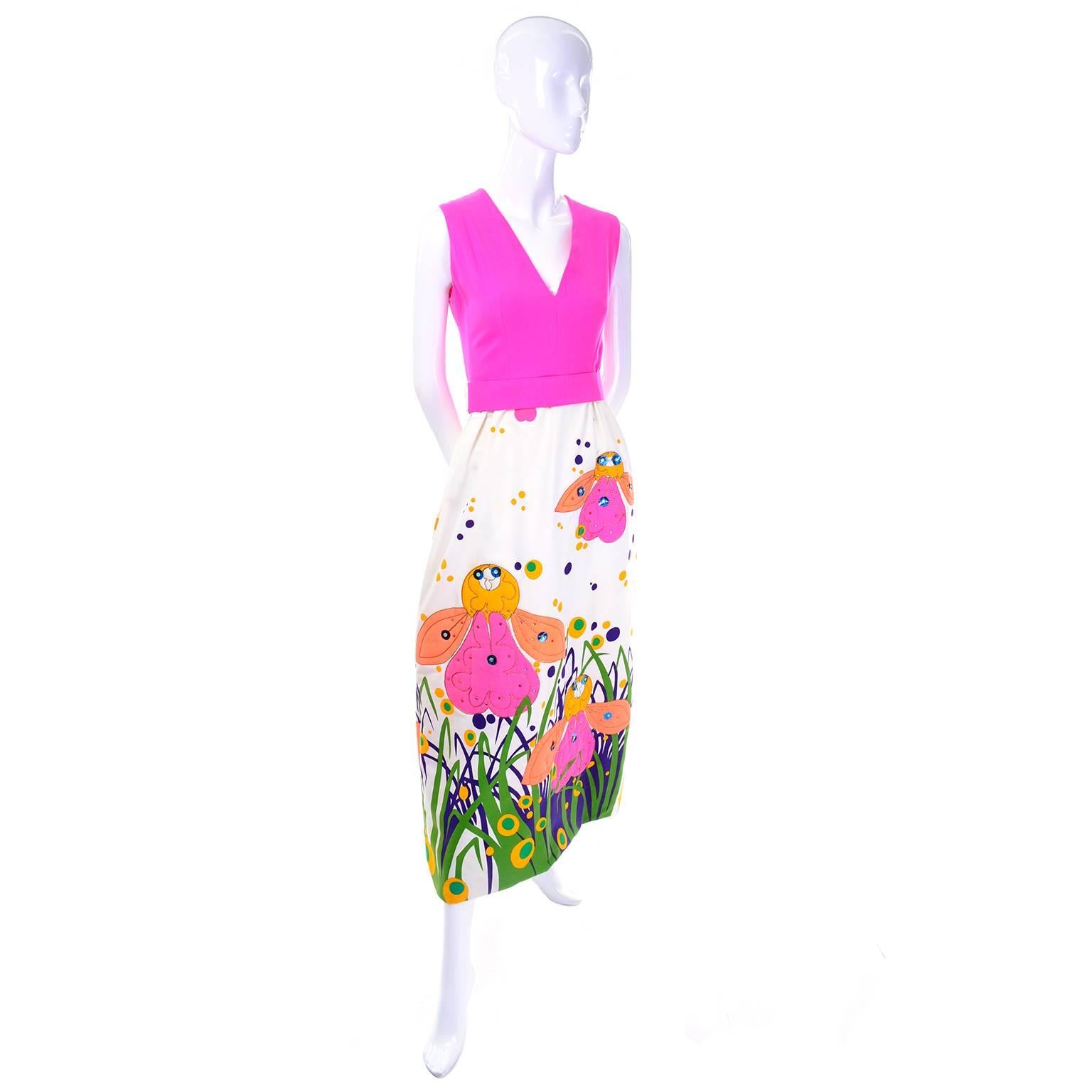 This vintage dress was designed by Gino Charles in the 1960's.This fabulous sleeveless maxi dress has a sensational rare design with a bright pink bodice and a v neck. The long skirt of the dress has polka dots, and bright pink, yellow and orange