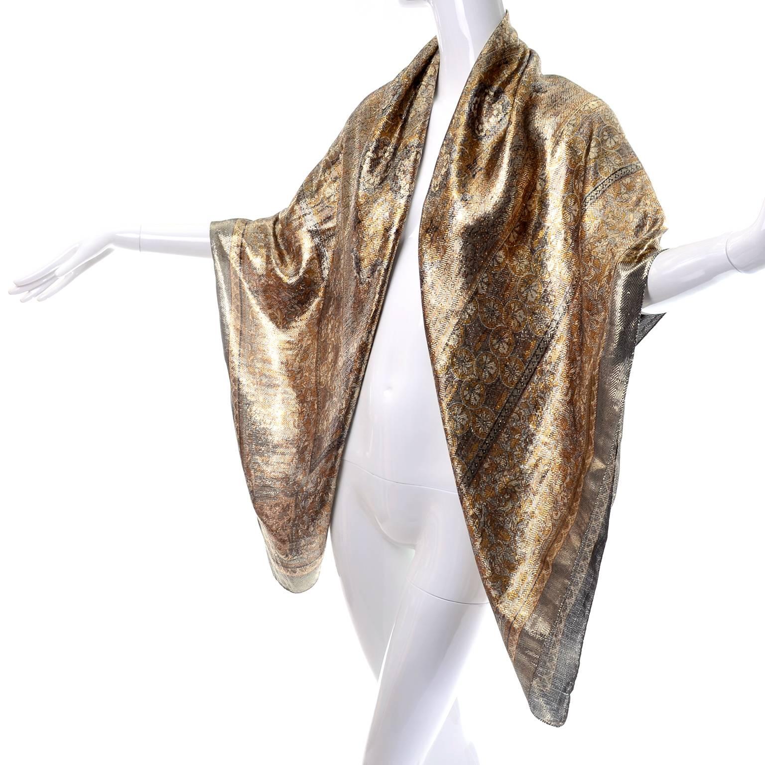 This sensation luxe large square metallic scarf is really stunning in person. The scarf comes from an estate of high end designer clothing and accessories but has no labels remaining. 
The gorgeous weaving creates a metallic chevron pattern across