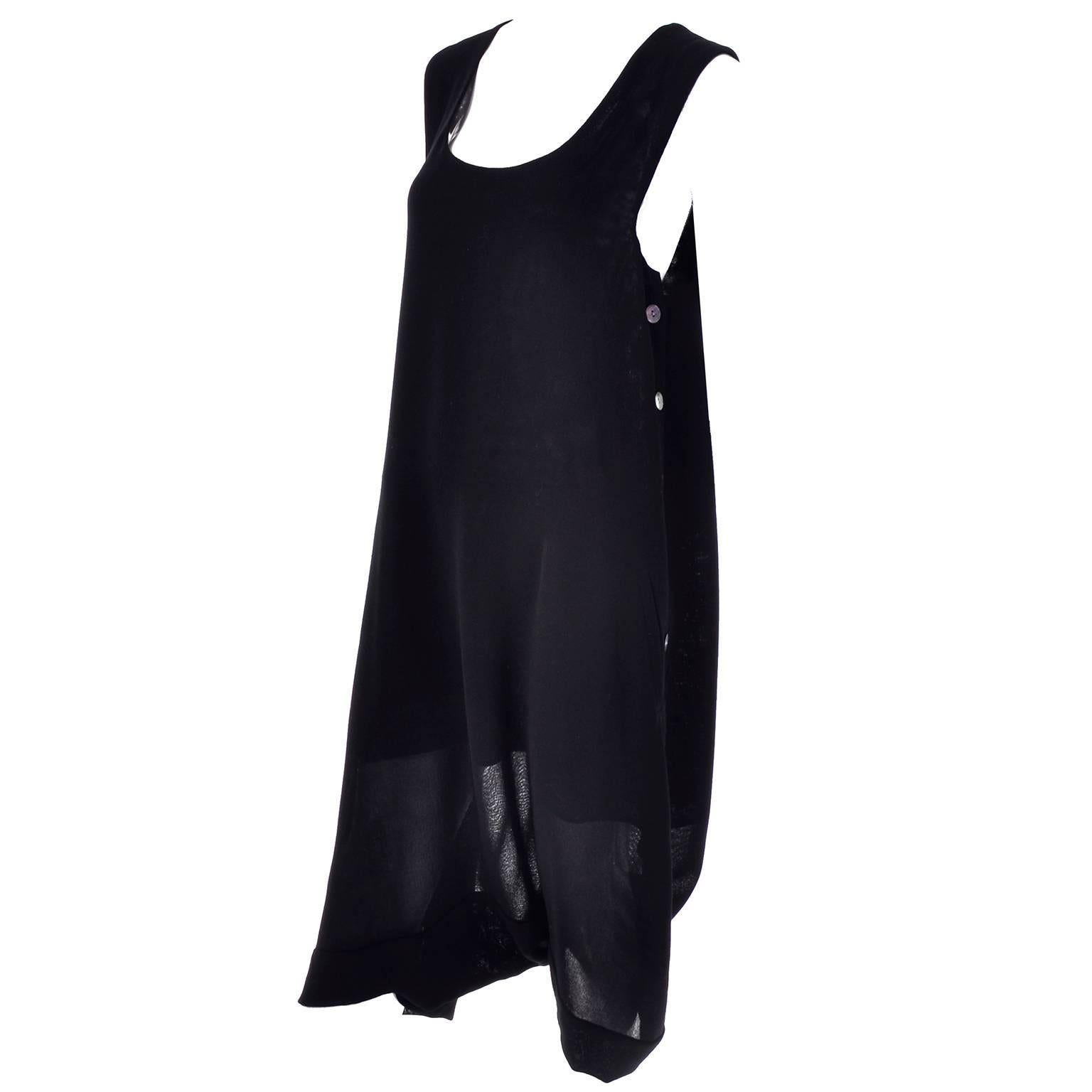 This outstanding vintage romper dress is from Issey Miyake and is made in a lightweight black wool. The details are almost impossible to show in the photographs! This sleeveless romper has a deep drop crotch and a scoop neck. This gorgeous