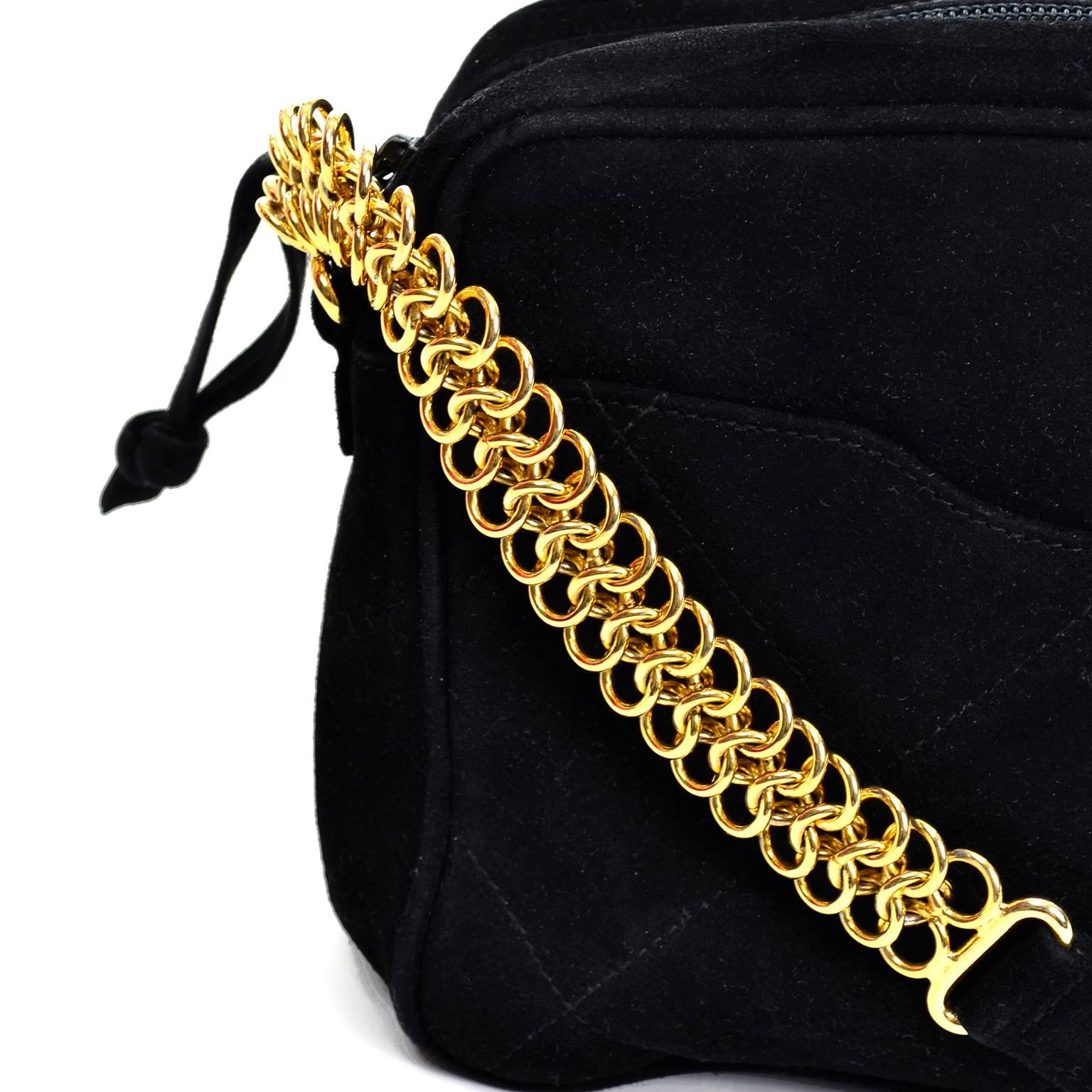 black suede bag with gold chain
