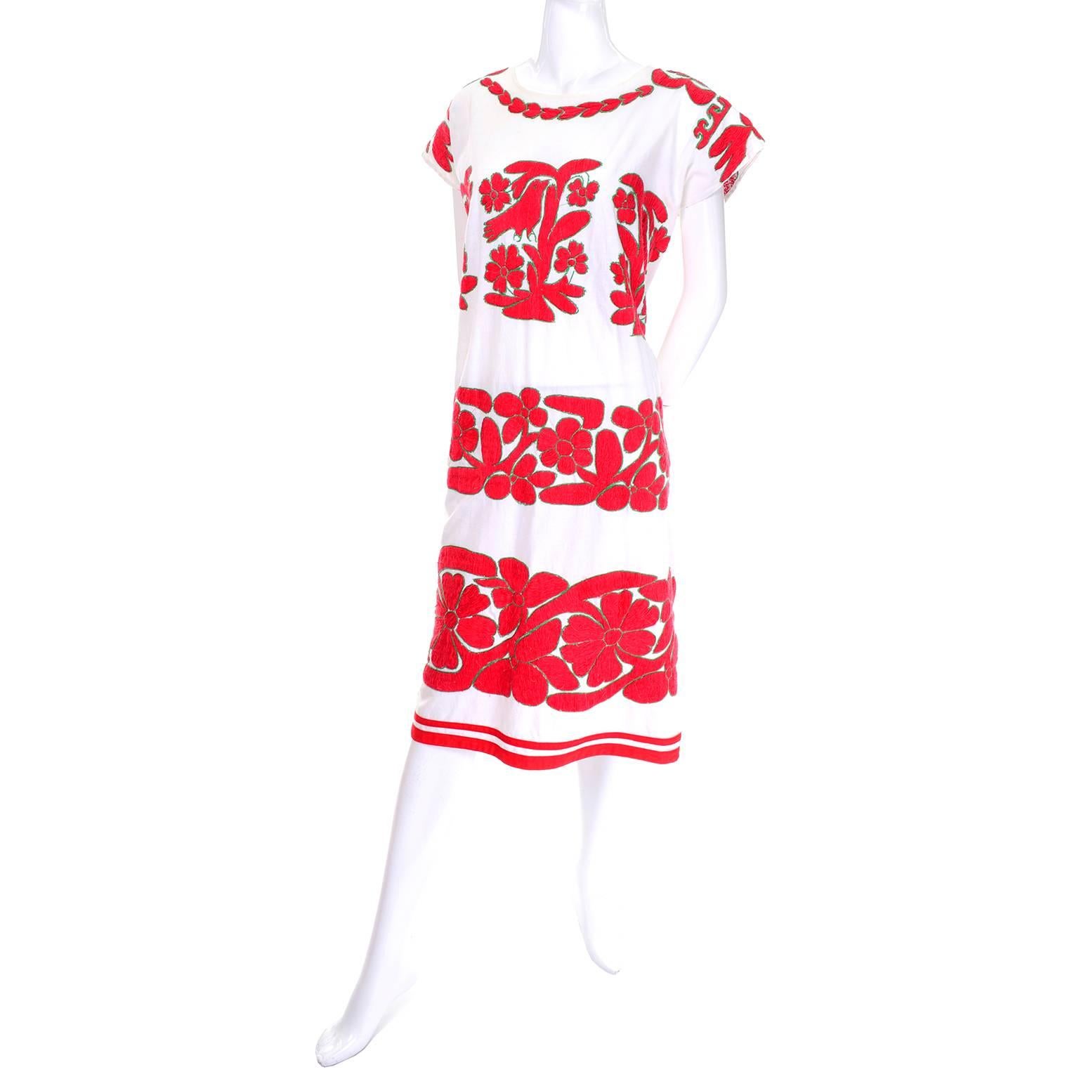 This outstanding vintage dress comes from an estate we acquired that included a collection of exceptional vintage 1960's Guatemalan and Mexican embroidered dresses.  This one has lovely thick red embroidery beautiful depicting birds, trees and
