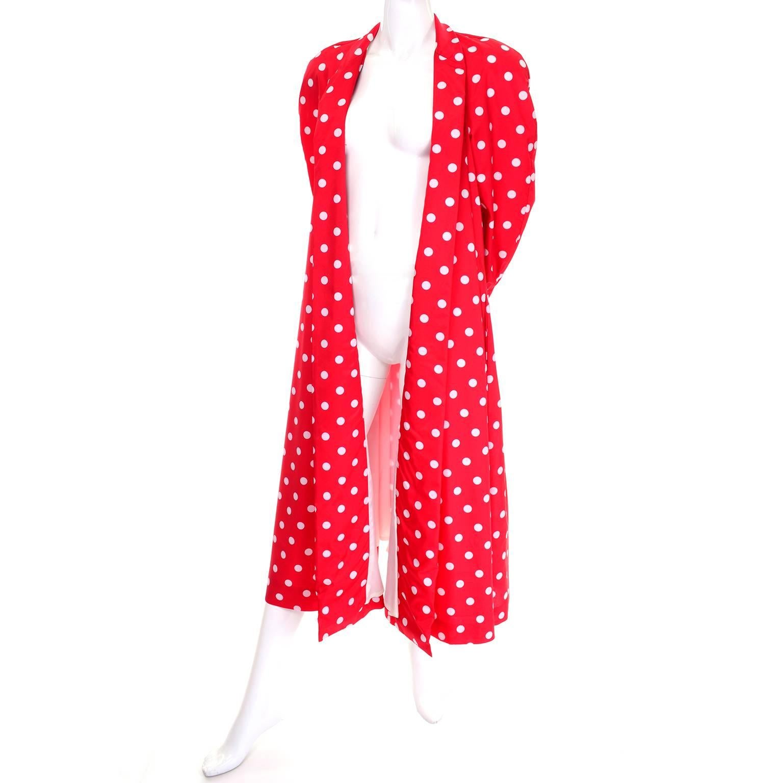 This is a fabulous 1980's Victor Costa for Bergdorf Goodman red summer evening coat with white polka dots. This lightweight open front coat has dramatic long raglan sleeves, puffy shoulder pads, and is fully lined in white. This coat can fit a