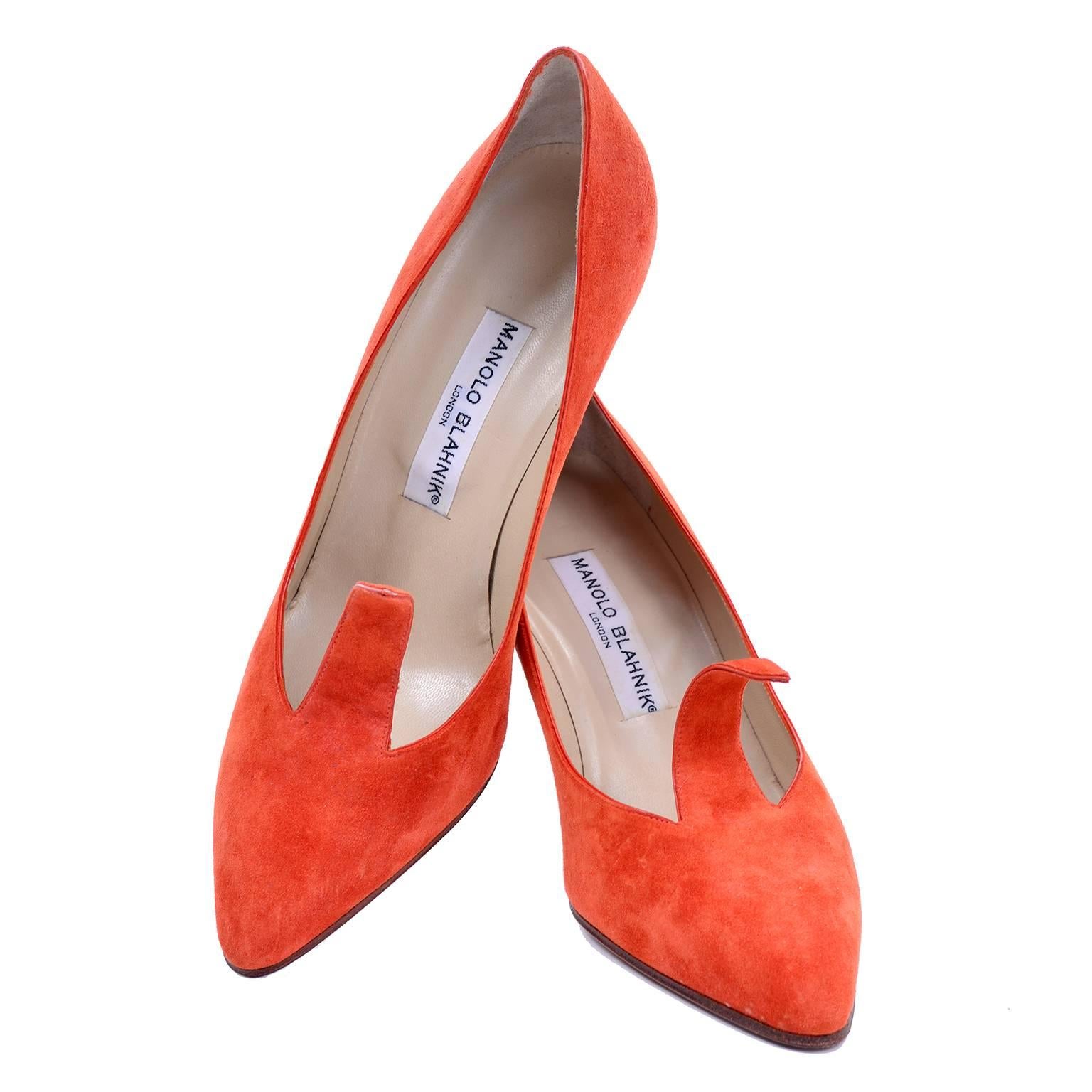 We adore these amazing orange suede vintage heels by Manolo Blahnik London, with a cutout pointed strip on the upper that is adjustable! You can form it to your foot, or curl it to your liking. These shoes have a rounded pointed toe. They have