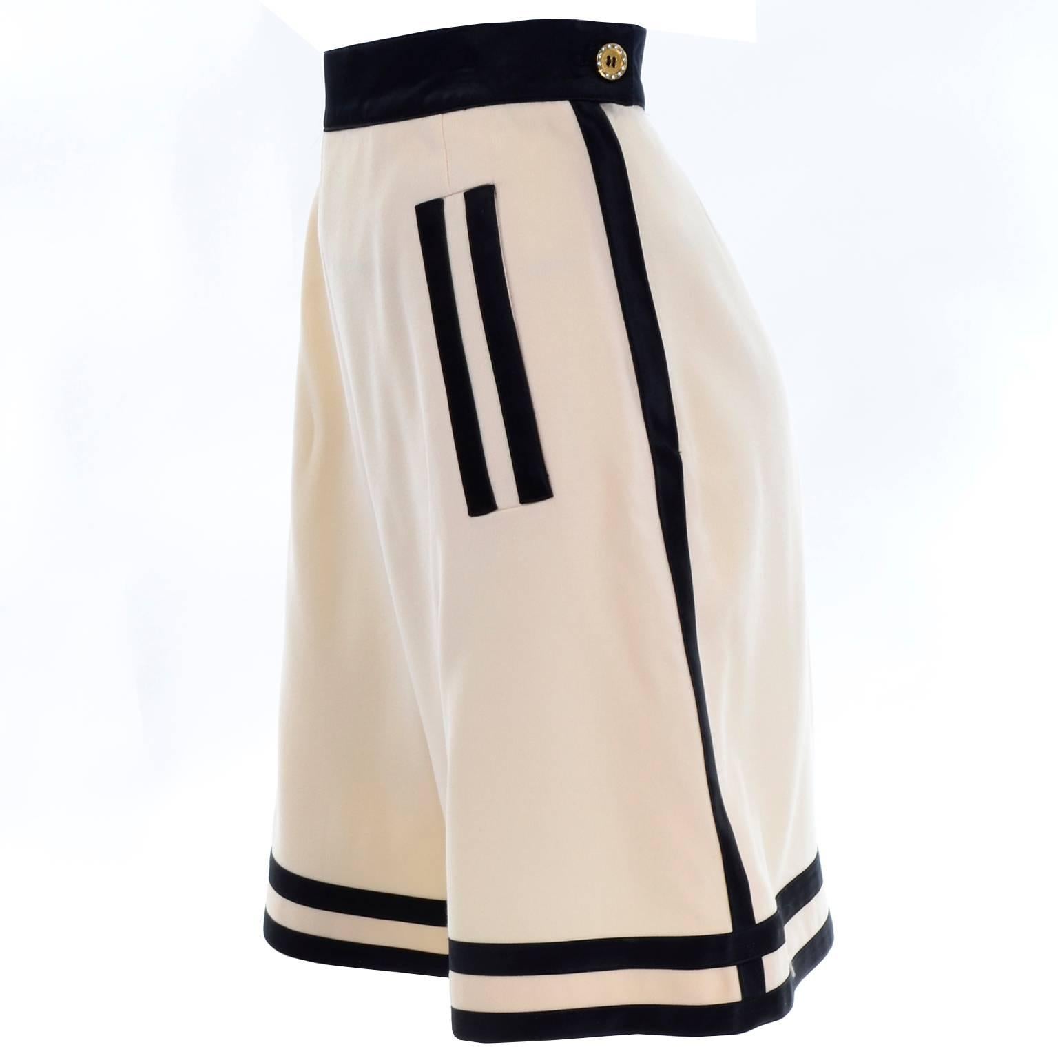 These fabulous high waisted vintage Escada Couture cream wool shorts have black satin stripe on the waistband and down the sides. These are perfect for Fall or Winter, and we love the way they fit!  There are also two black satin stripes on the side