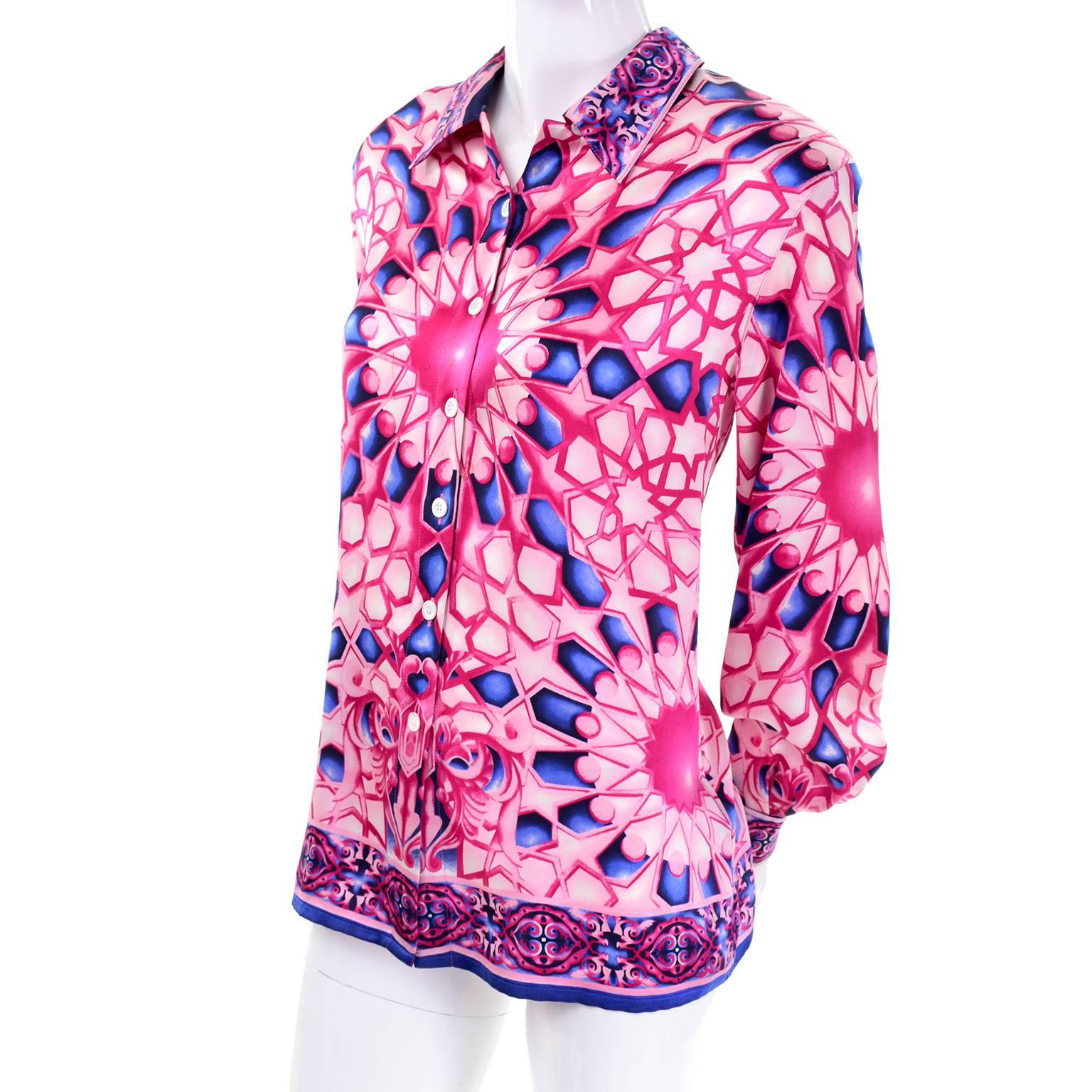 This vintage silk Escada Blouse has a Versace - esque vibe. The luxurious silk fabric has a pink and blue abstract geometric design and is labeled a size 40, and we estimate this would best fit a modern size 40