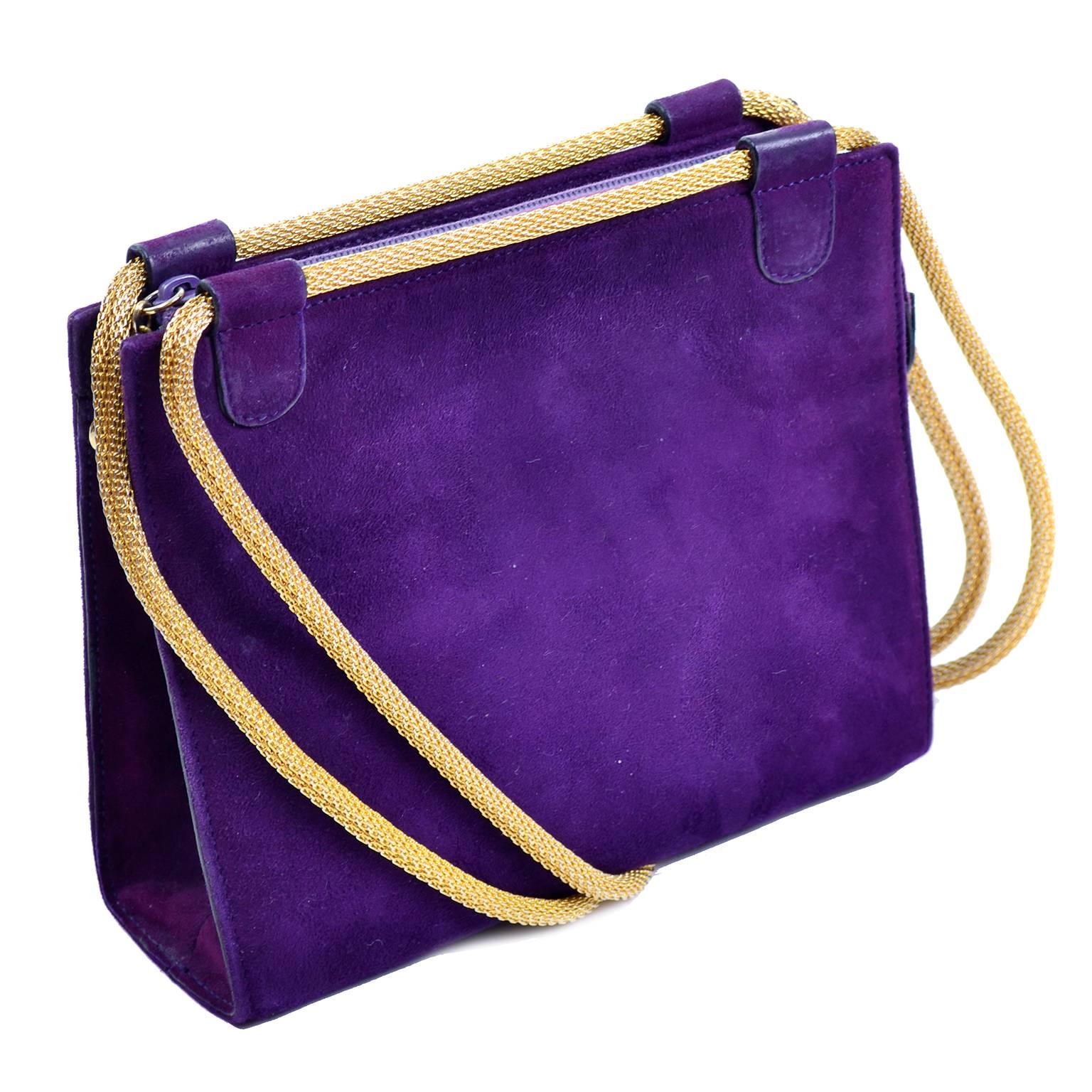 This is a fabulous vintage purple suede handbag designed by Walter Steiger. We have always loved vintage Walter Steiger shoes and were thrilled to come across his vintage handbags! The bag measures 6.5