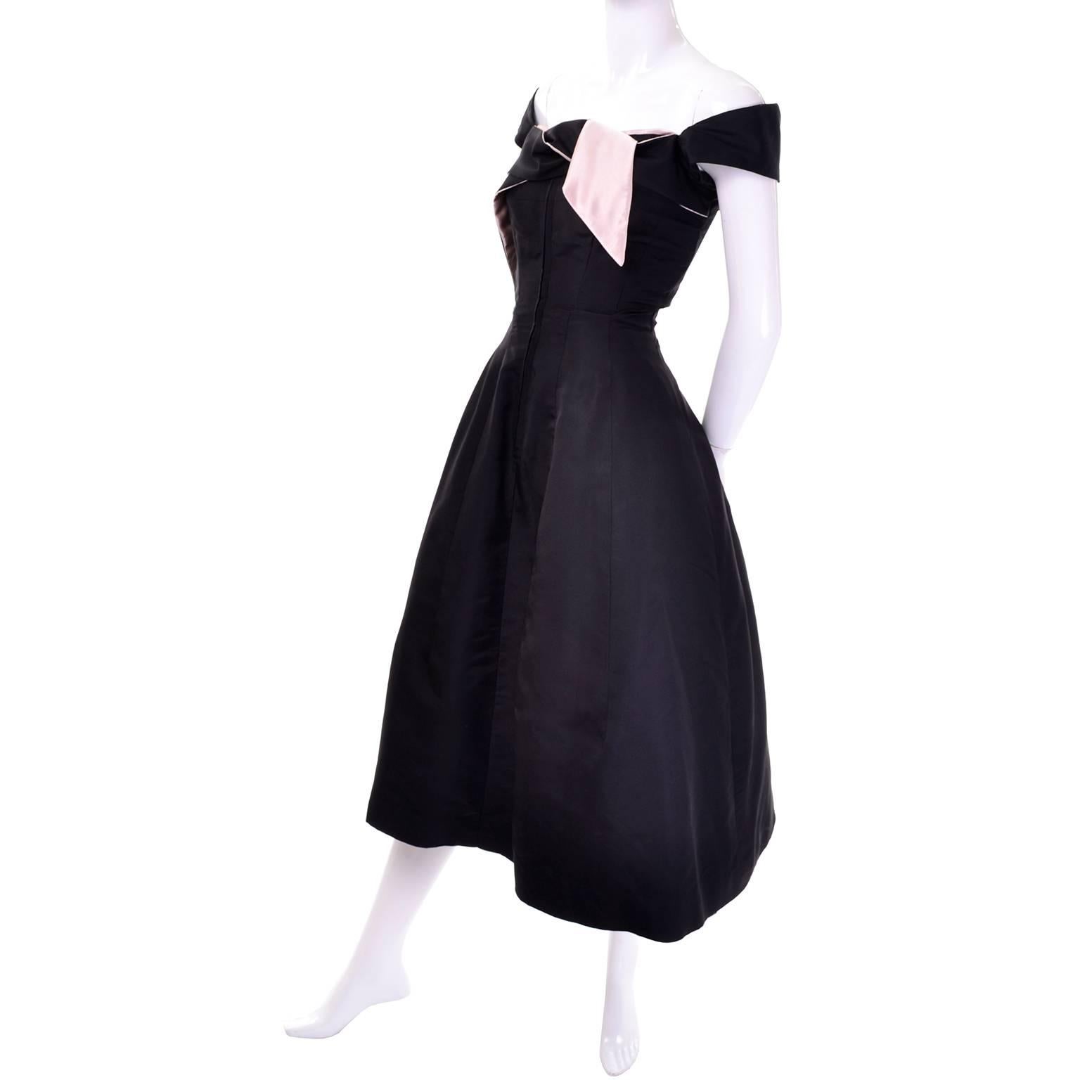 This rare late 1940's vintage Nettie Rosenstein silk faille dress is from an estate we acquired that included every important designer from the mid 20th century through the 1970's.  This dress zips up the front and has an attached sash at the bodice