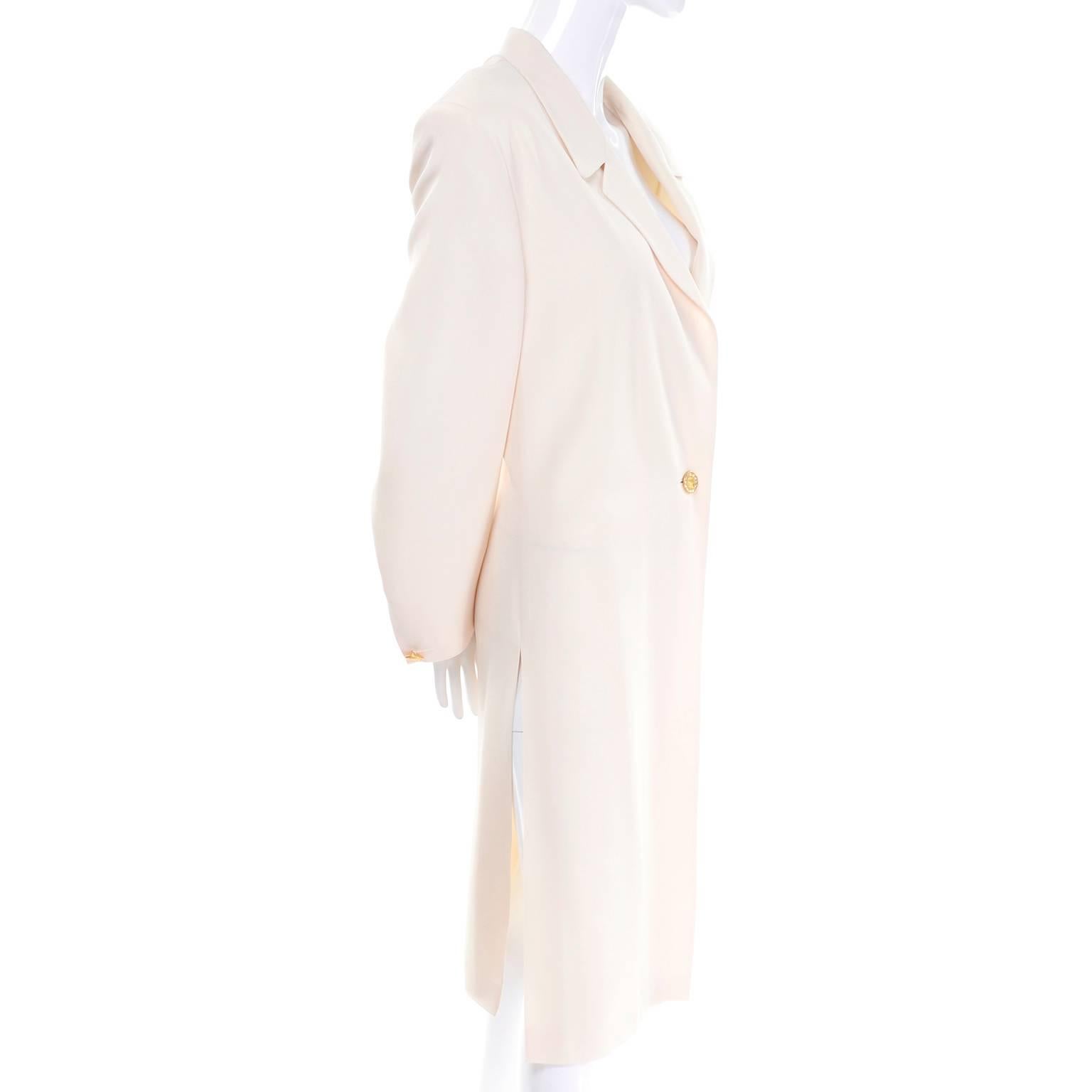 The photographs just don't show how beautiful this incredible Escada evening coat is in person!  We have quite a few Escada vintage items for sale on 1stdibs right now from an estate we acquired recently.  This beautiful Escada couture creamy ivory