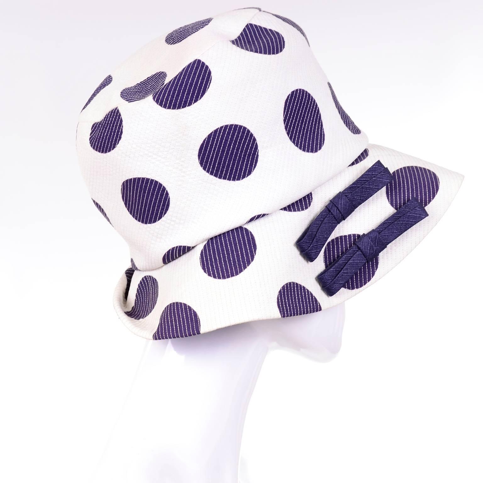 This great vintage hat is from the 1960's and is in a white fabric with navy blue polka dots and navy blue lining.  The label reads Josie New York Paris.  The hat has a 20