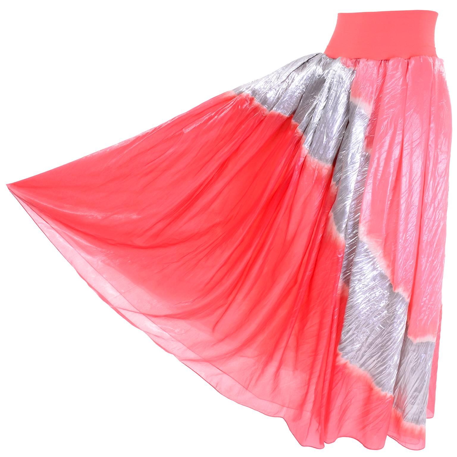 This is an exquisite 1990's long vintage skirt from Donna Karan that is so hard to describe with words! This incredible luxe evening skirt is made of organza and lame. The skirt has a silk jersey waistband and it comes with a fringed ultra fine net