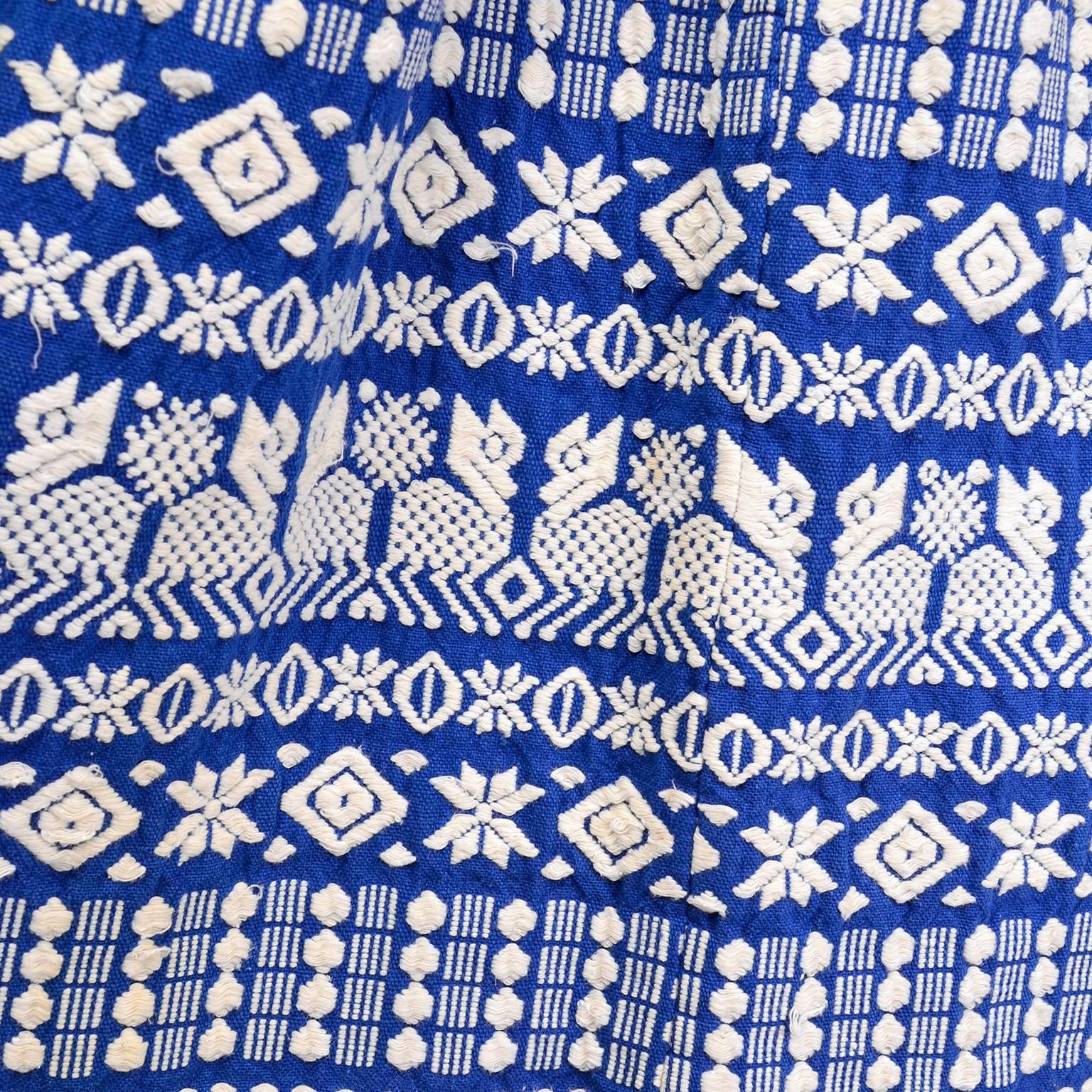 This is a wonderful vintage mid century blue Folk skirt with gorgeous white embroidery that was made in Guatemala.  We acquired this from one of an incredible estate that included outstanding hand embroidered clothing and accessories. The quality of
