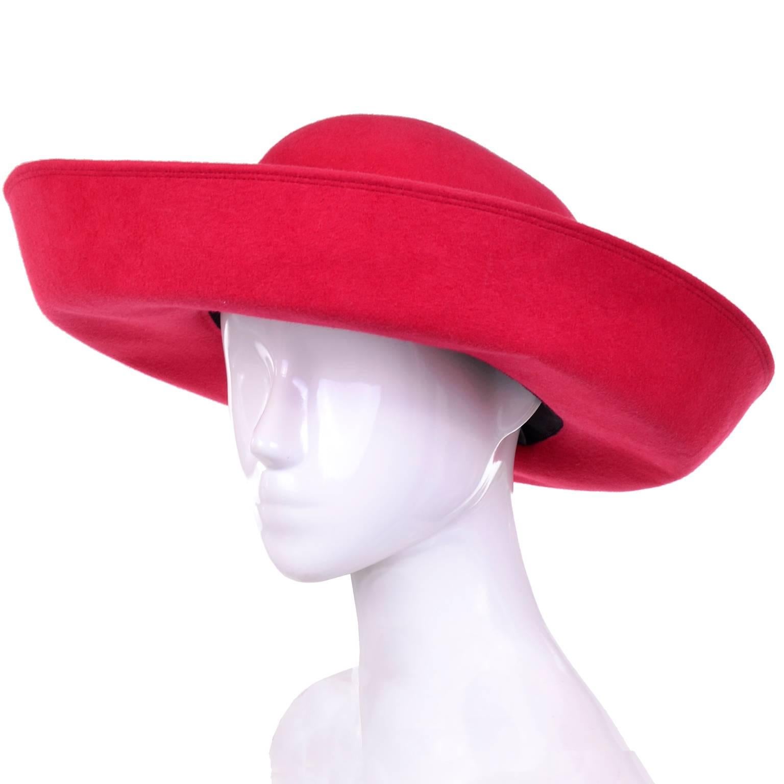 This is a vintage Patricia Underwood wide brim scarlet red wool hat that was never worn and still has its original Bergdorf Goodman tag attached. The hat measures  21