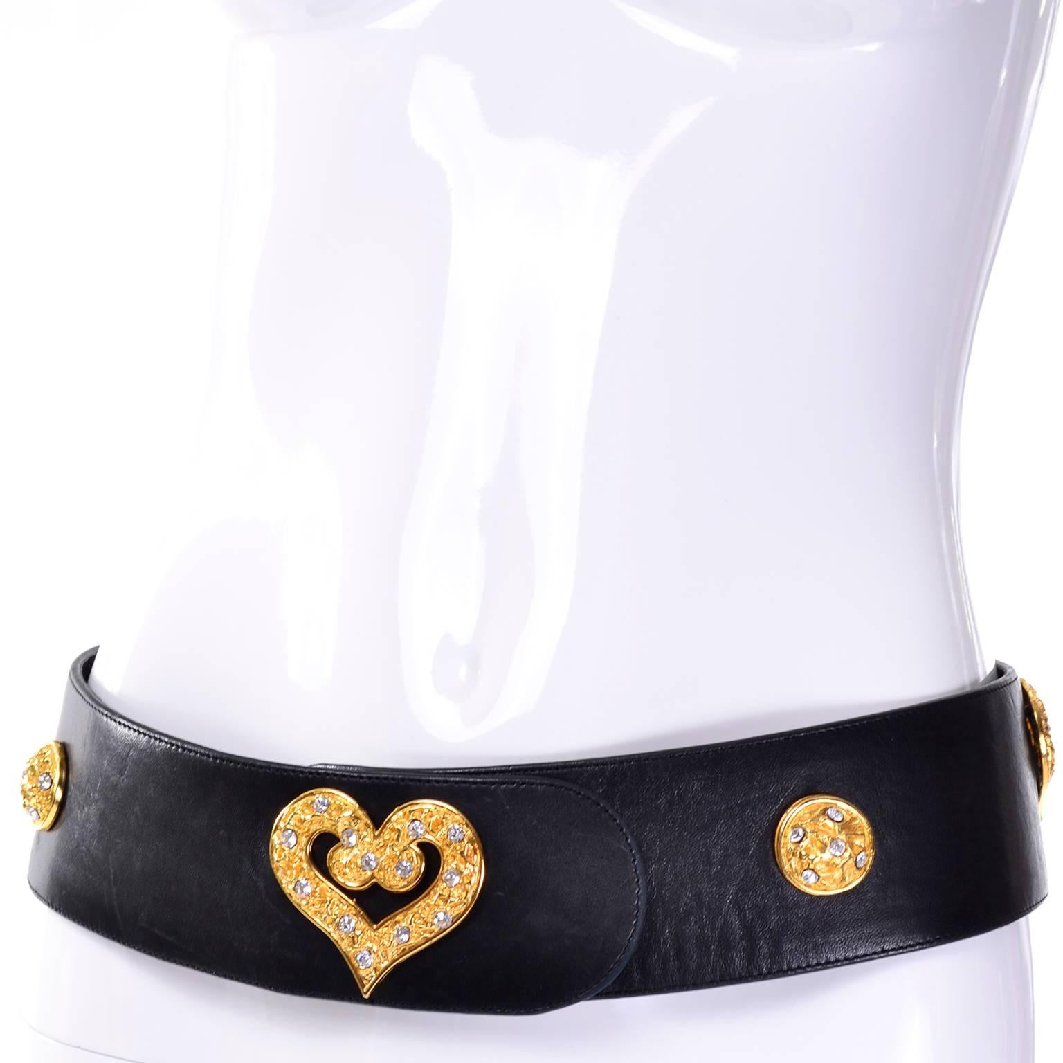 This vintage 1980's black leather belt was designed by Edouard Rambaud and it is beautifully embellished with gold hearts and gold domes with rhinestones.  The belt is 2 and 1/2