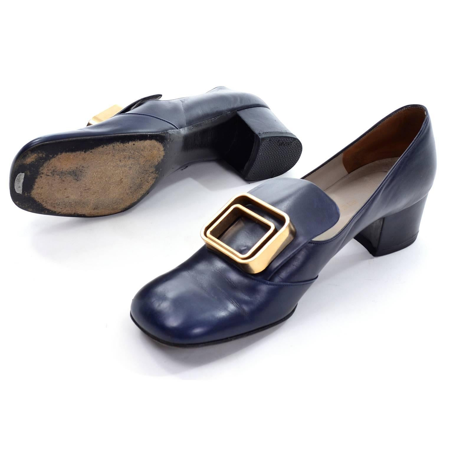 These navy blue leather Pierre Cardin Vintage shoes were made in the 1960's and they have fabulous double gold buckle and 2 inch chunky heels. The shoes are marked a size 8N and were made in France. These shoes measure 3