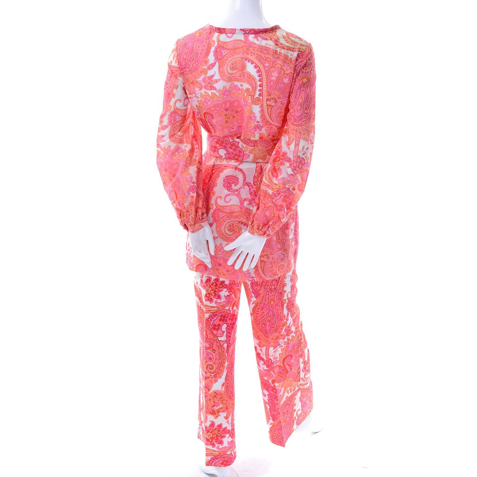This 2 piece orange and pink paisley pants and tunic ensemble is another one that came from our favorite estate of all time. The outfit only has a small size label, but all of the clothing and accessories from this estate were from important