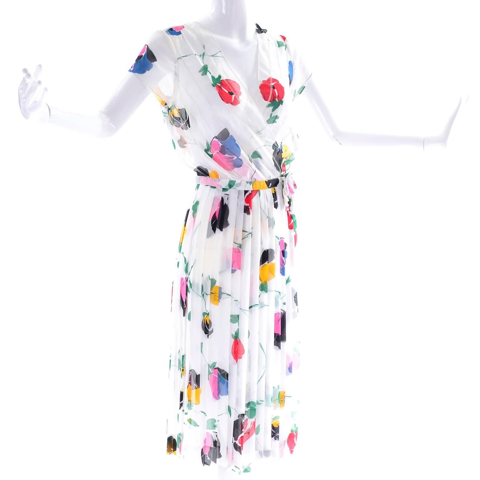We have been really drawn to vintage Albert Nipon dresses lately. He had such a great way with day dresses especially, and they fit seamlessly into modern wardrobes! This Albert Nipon sheer floral chiffon dress has a pleated skirt and a pretty